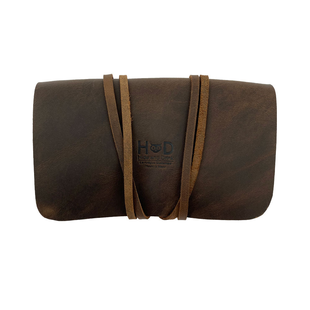 Hide & Drink Tobacco Pouch elegantly closed, a fantastic vintage storage solution for your smoking essentials, made from high-quality leather, hand cut, and sewn.