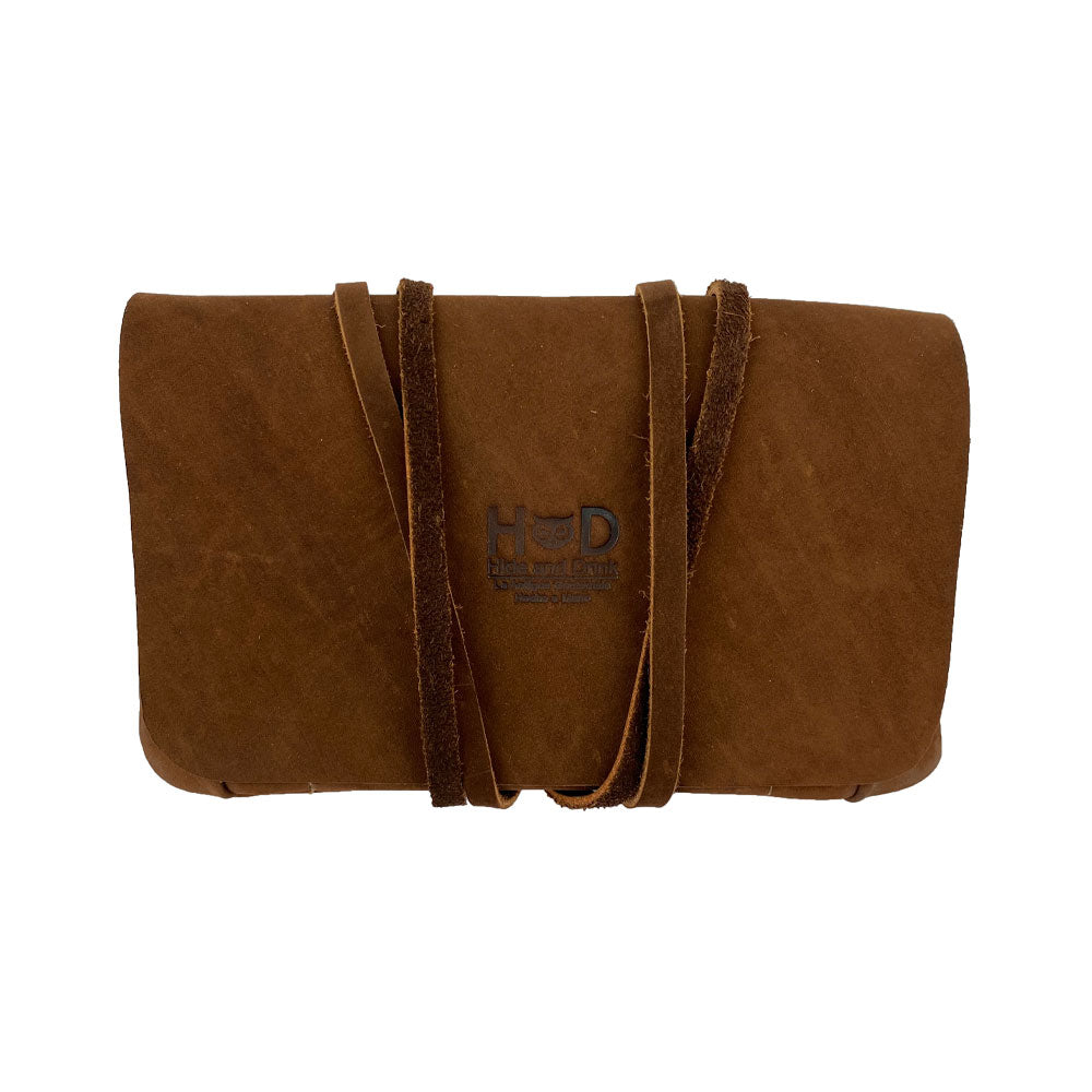 Hide & Drink Tobacco Pouch beautifully closed, a true representation of classic case art created from high-quality leather with a rustic flair.