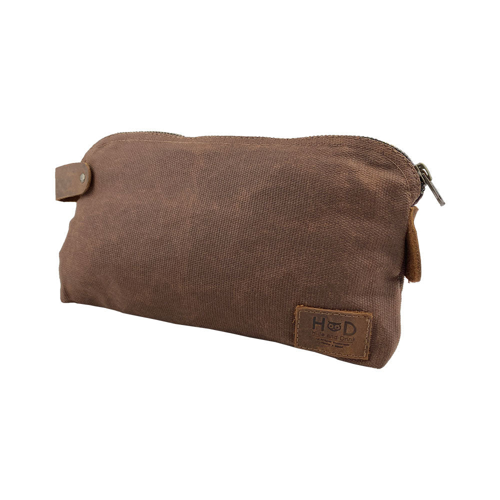 Dopp Kit Utility Bag by Hide & Drink highlighting its quality craftsmanship and classic appeal. This artisan Dopp Kit Utility Bag for cords & chargers is made from full grain leather with emphasis on hand cut and hand sewn styles, handmade in La Antigua Guatemala & Oaxaca Mexico.