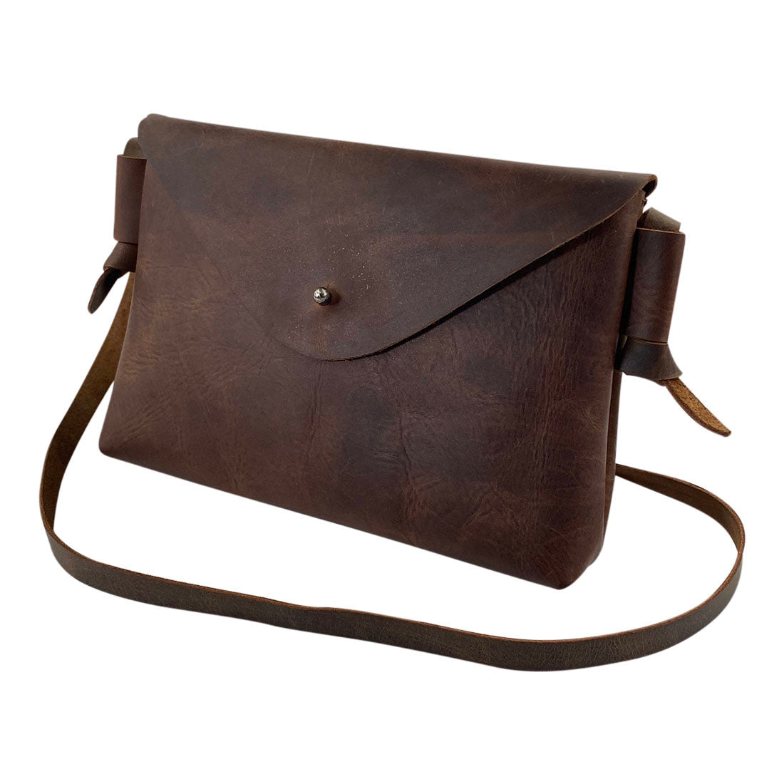 Elegant Horizontal Shoulder Bag by Hide & Drink, designed for versatility and style. Made of Full Grain Leather, this artisan product is hand cut and hand sewn, reflecting the craftsmanship of small batch production from La Antigua Guatemala & Oaxaca Mexico.