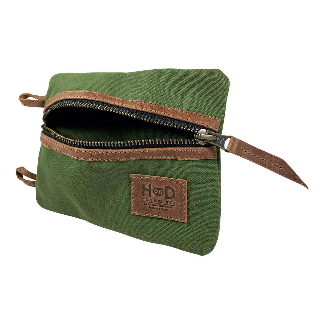 Side view of the green Multi-tool Pocket Pouch - XL by Hide & Drink, showing off its zippered pocket and durable design for outdoor activities. Multi-Tool Pocket Pouch XL, Compact Multipurpose EDC Zippered Bag, Knife Holster, Handmade Slim Organizer, Waxed Canvas, StockyardX, Small Batch Production, Artisan, Handmade in La Antigua Guatemala & Oaxaca Mexico.