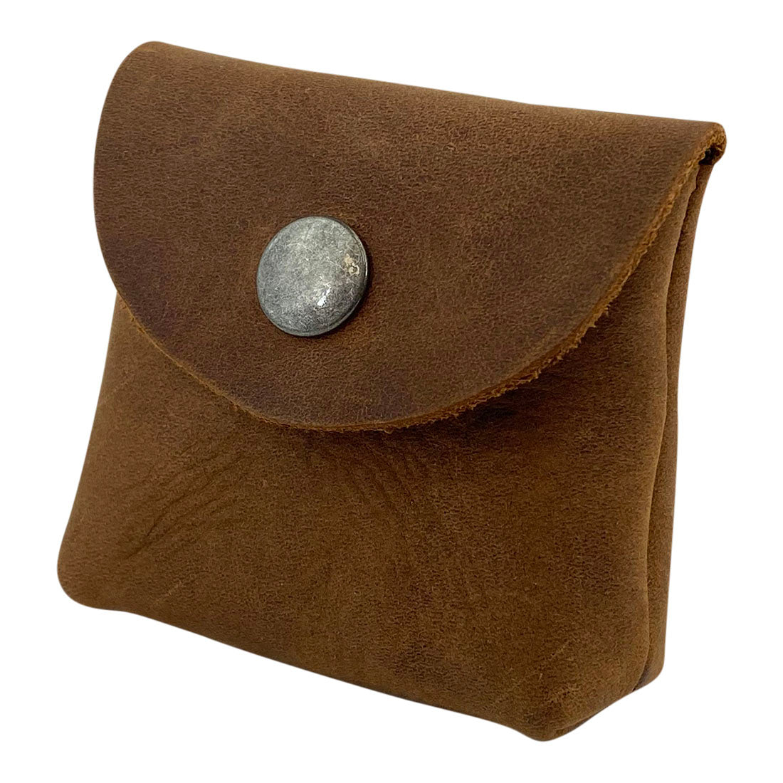 The Vintage Coin Pouch from Hide & Drink presented at an angle, highlighting its compact design and the attractive full grain leather exterior. Ideal for organizing coins and small items, this handmade pouch is perfect for everyday use. Cigarette Pack Cover/Holder/Tobacco Case/Accessories, Full Grain Leather, StockyardX, Small Batch Production, Hand Cut, Hand Sewn, Fire Branded, Artisan, Handmade in La Antigua Guatemala & Oaxaca Mexico.