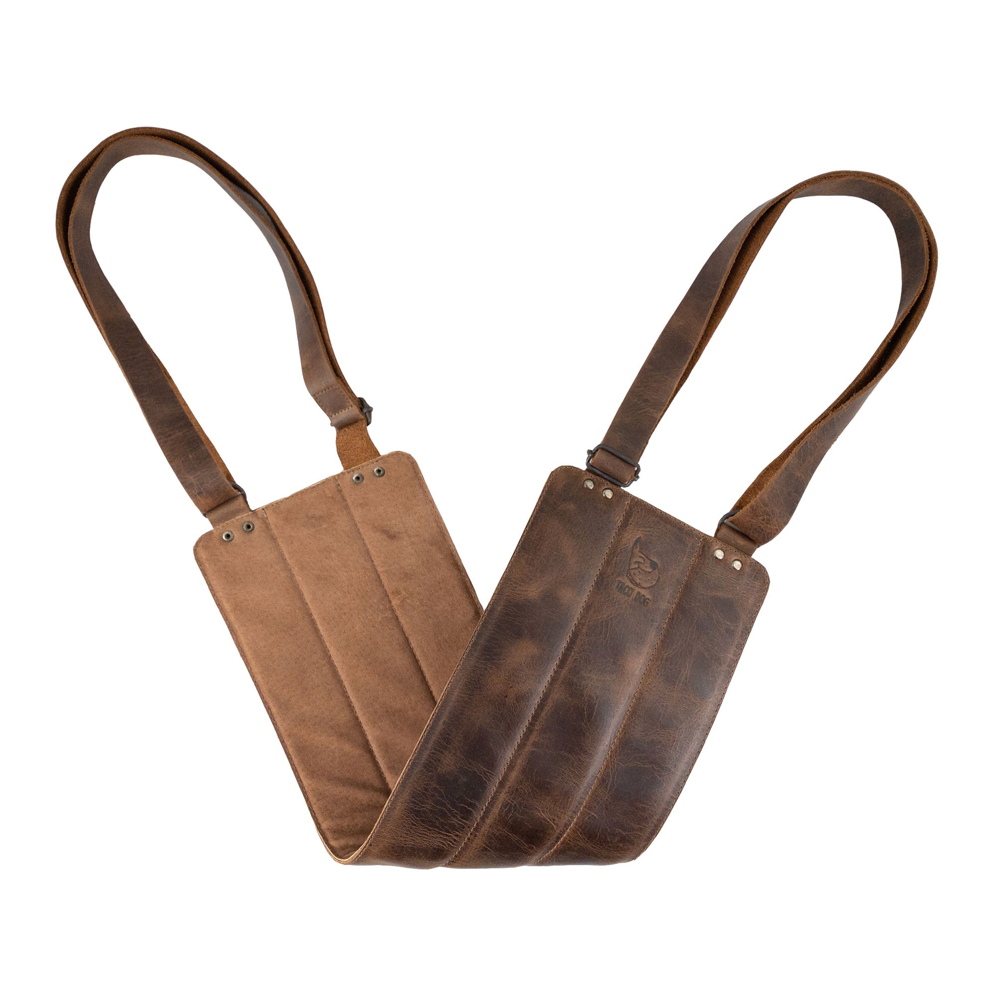 Rustic Dog Lift Harness by Taco Dog depicted in action, being used to support a dog. This handmade recovery sling for rear legs offers a safe way to help pets during rehabilitation. The harness, made from Full Grain Leather, combines durability with style and is artisan crafted in small batches. Hand stitched and fire branded, showcasing the quality of handmade work from La Antigua Guatemala & Oaxaca Mexico.
