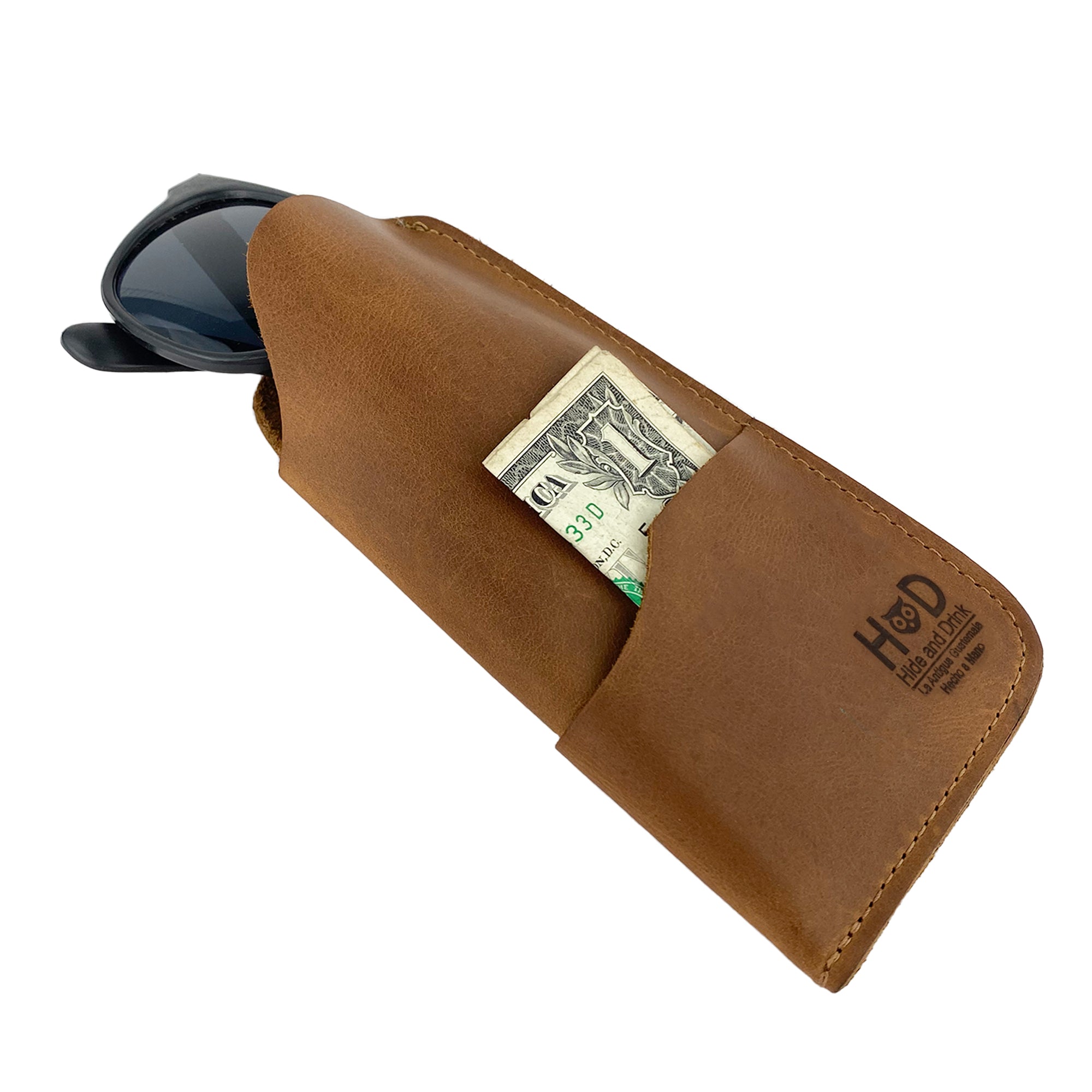 Elevating style with the Hide & Drink Sunglass Case & Wallet in dark brown leather, essential for the discerning traveler. This Rustic Sunglasses Case & Wallet is made from Full Grain Leather, a must-have eyeglasses protector for travel, handcrafted in La Antigua Guatemala & Oaxaca Mexico.