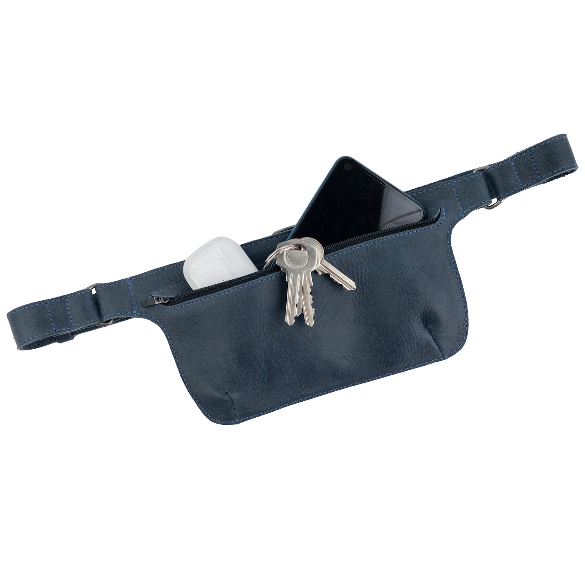 Slim Fanny Pack by Hide & Drink shown in profile with an adjustable strap, perfect for everyday use as a phone holder. This artisan-crafted full grain leather fanny pack is handmade in Oaxaca Mexico.