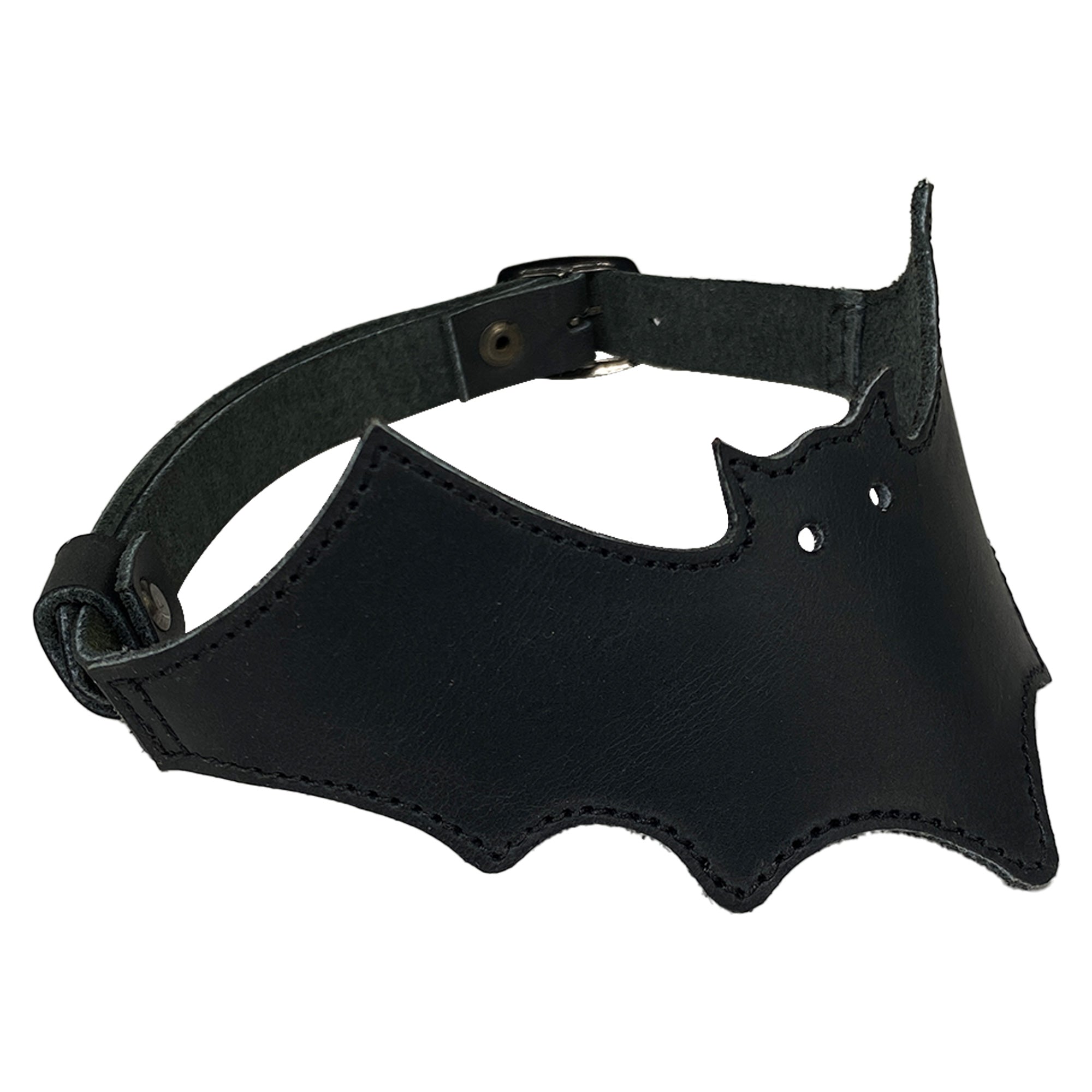 Side view of the Bat-man Choker by Hide & Play, displaying the intricate bat shape and details in the full grain leather. This Bat Choker serves as a trendy accessory, hand sewn and fire branded, ideal for making a bold fashion statement.