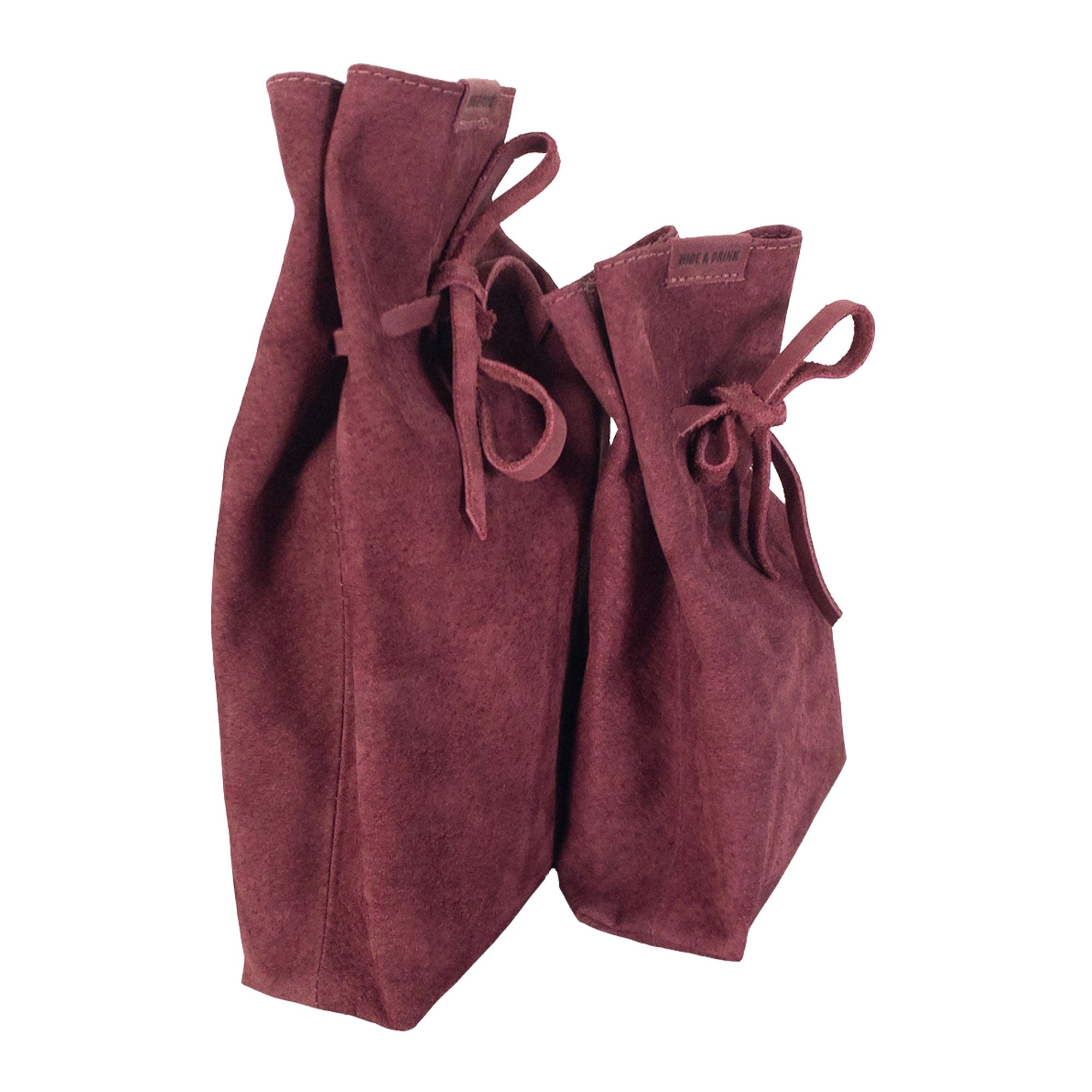 Side view of Hide & Drink's Drawstring Sack (2 pack), illustrating its effective design for organization and stylish use. Drawstring Sack (2 pack) Handmade from Sheepskin and Full Grain Leather, StockyardX, Small Batch Production, Hand Cut, Hand Sewn, Fire Branded, Artisan, Handmade in La Antigua Guatemala & Oaxaca Mexico.