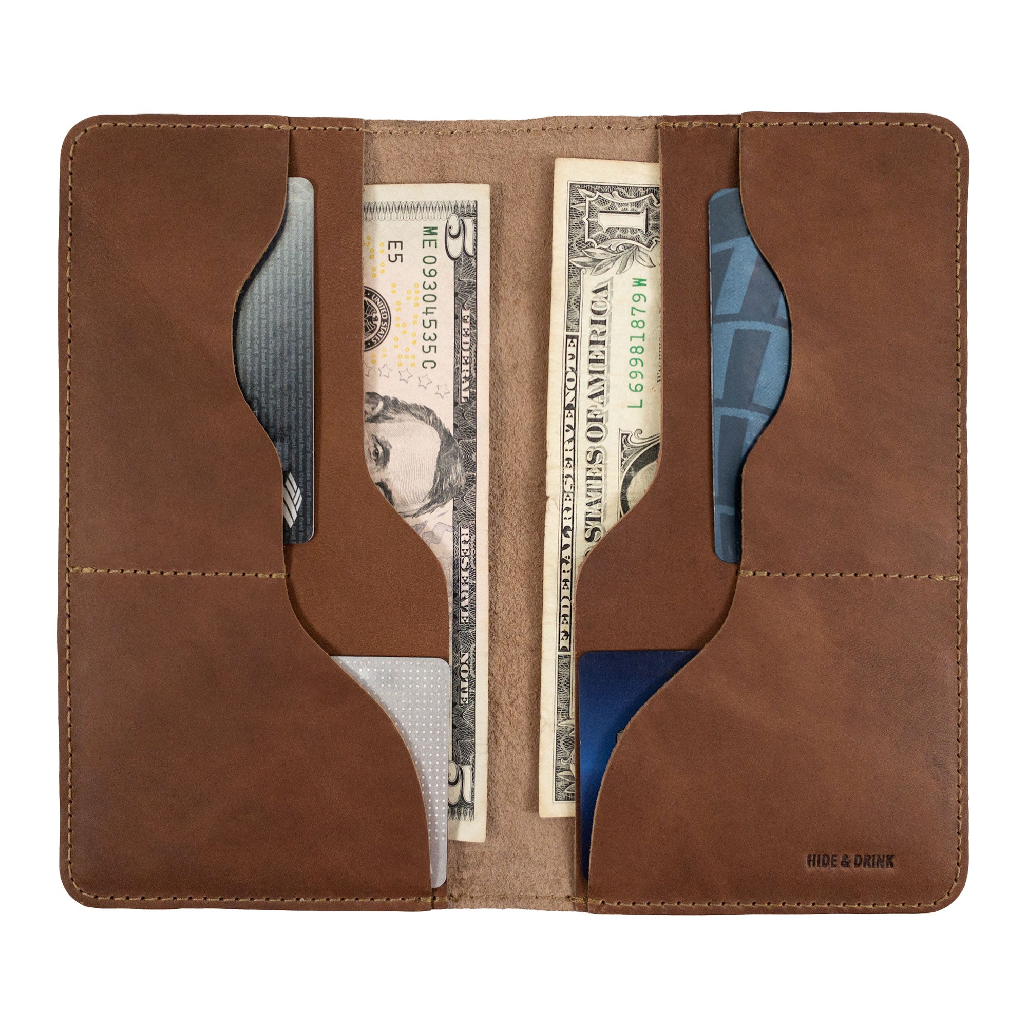Hide & Drink Large Organizer Wallet in use with cash and cards. This handmade bifold wallet is made from premium full grain leather and is an excellent night bag and travel accessory, showcasing artisan quality from La Antigua Guatemala & Oaxaca Mexico.