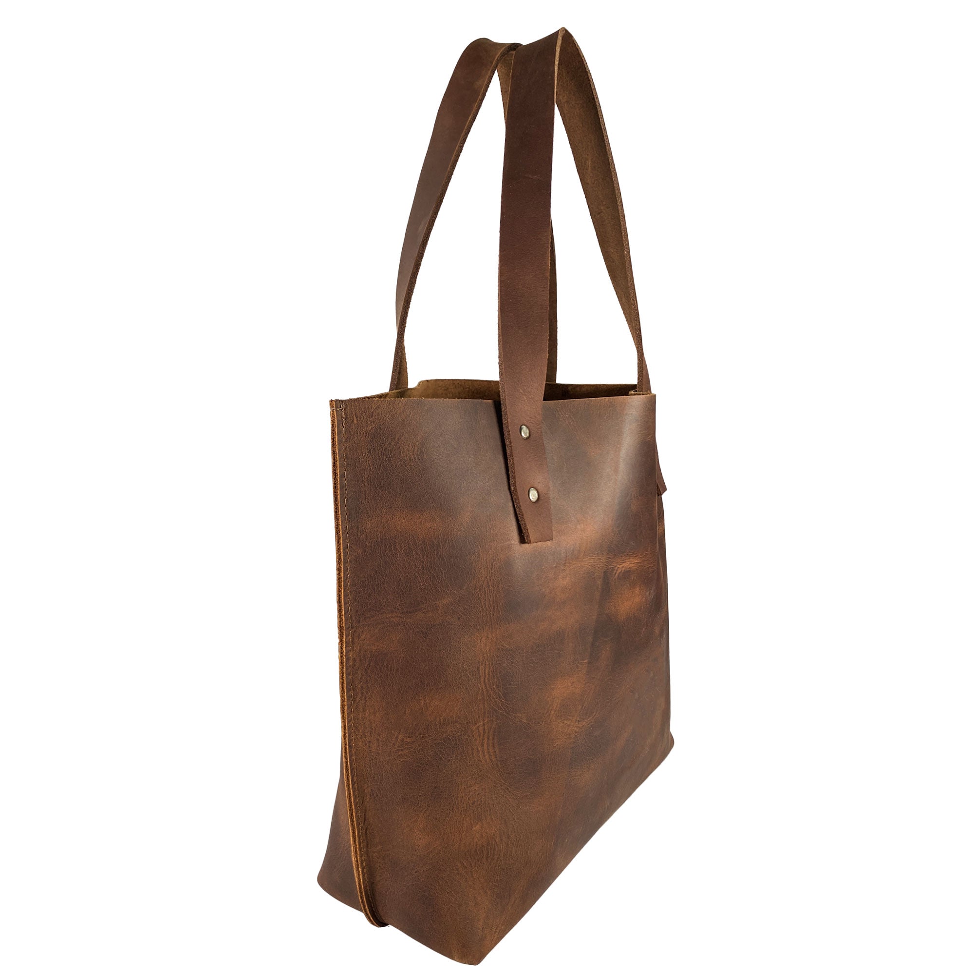 Side view of Heather's Minimalist Shoulder Bag, featuring a sleek design and sturdy handles. This spacious and classy Minimalist Handbag Vintage Purse with Handle is made of durable Full Grain Leather and is handmade by skilled artisans in Guatemala.