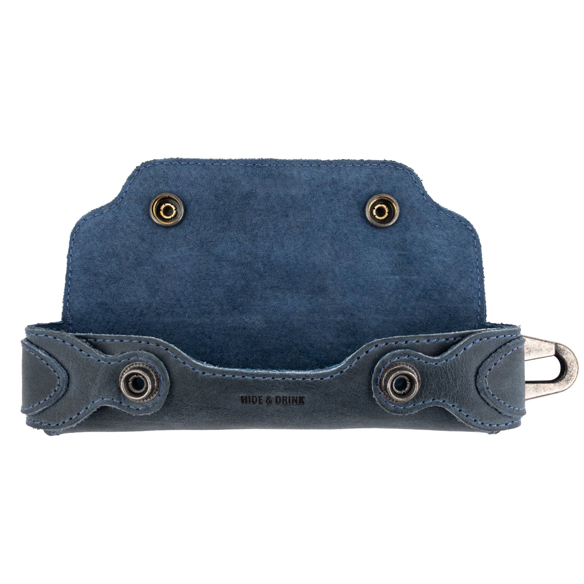 Interior view of the blue Harmonica Case by Hide & Drink, showcasing its secure storage for harmonicas. This vintage style protector is made from full grain leather, reflecting the artisan quality of small batch production in La Antigua Guatemala.