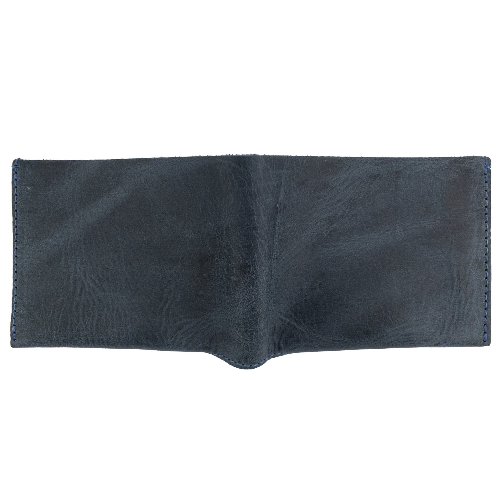 Side view of the navy blue Hide & Drink Classic Wallet, highlighting its sleek design and premium materials for the minimalist. Classic Wallet, Card Organizer, Money Holder, Vintage Pocket, Travel Accessories, Full Grain Leather, StockyardX, Small Batch Production, Hand Cut, Hand Sewn, Fire Branded, Artisan, Handmade in La Antigua Guatemala & Oaxaca Mexico.