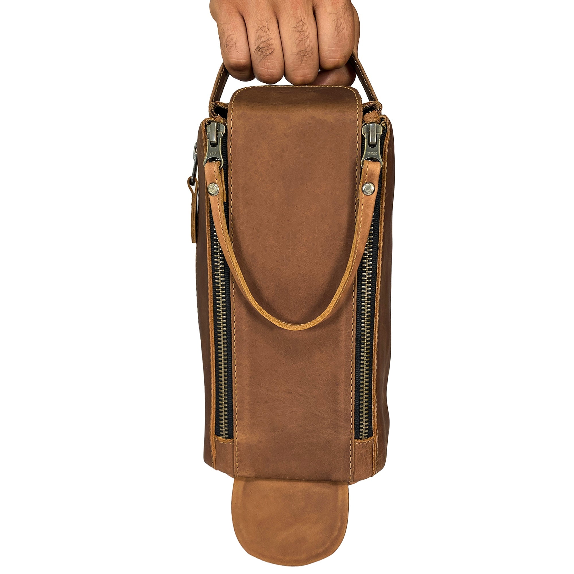 Close-up view of Hide & Drink's Toiletry Bag showing stitching details, emphasizing its craftsmanship. This Full Grain Leather Toiletry Bag is stylish as a Hand Bag and practical as a Dopp Kit Organizer. StockyardX, Handmade, S.