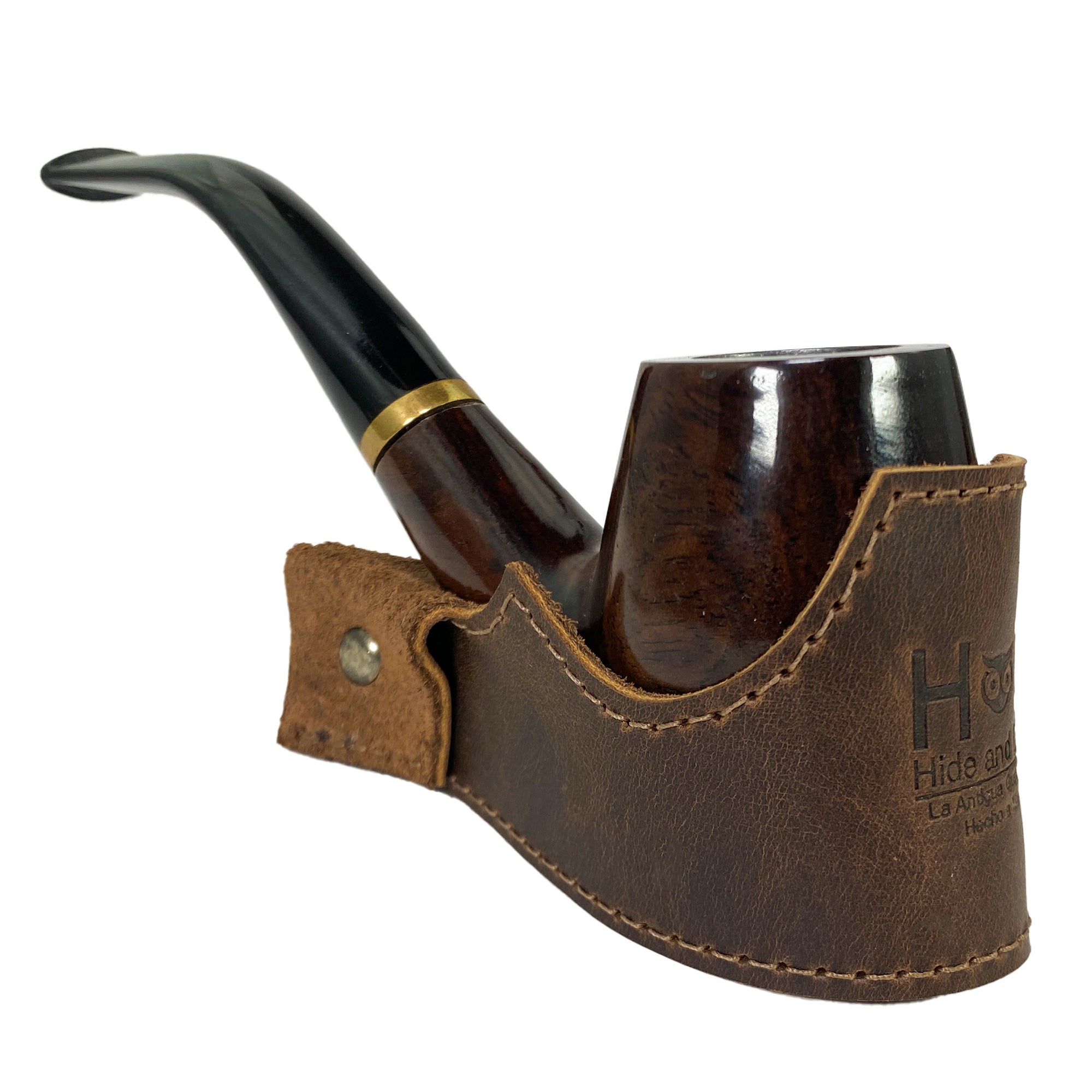 Tobacco Pipe Holder by Hide & Drink elegantly holding a pipe, combining functionality with aesthetic appeal. This Tobacco Pipe Holder (Pipe not Included) serves as a portable & adjustable stand, enhancing your smoking experience. Crafted from full grain leather through small batch production, it's a hand sewn, fire branded artisan product made in La Antigua Guatemala & Oaxaca Mexico.