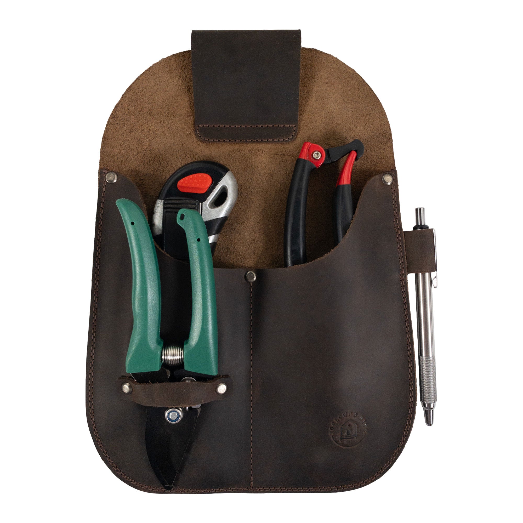 Gardening Tool Holder by Toolshed Hide filled with essential gardening tools. This versatile Gardening Tool Holder made from full grain leather emphasizes small batch production, crafted by hand through hand cutting and sewing techniques, and features fire branded artisan details. Handmade in La Antigua Guatemala & Oaxaca Mexico.