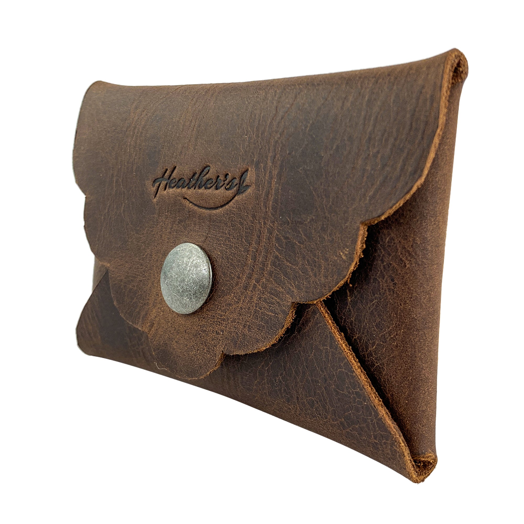 Side profile of the Stylish Envelope by Heather's, highlighting the quality craftsmanship and full grain leather. Perfect as a classy organizer, it provides compact storage for debit and credit cards with its hand cut and hand sewn details, reflecting small batch production and fire branding for an artisanal feel, handmade in La Antigua Guatemala & Oaxaca Mexico.