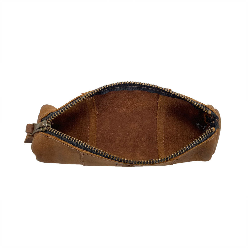 Inside view of the Utility Cylinder Case by Hide & Drink, highlighting its spacious interior for office supplies or cables. This rustic, handmade bag is crafted from Full Grain Leather in La Antigua Guatemala. Cylinder Case, Classic Bag, Small Batch Production, Artisan.