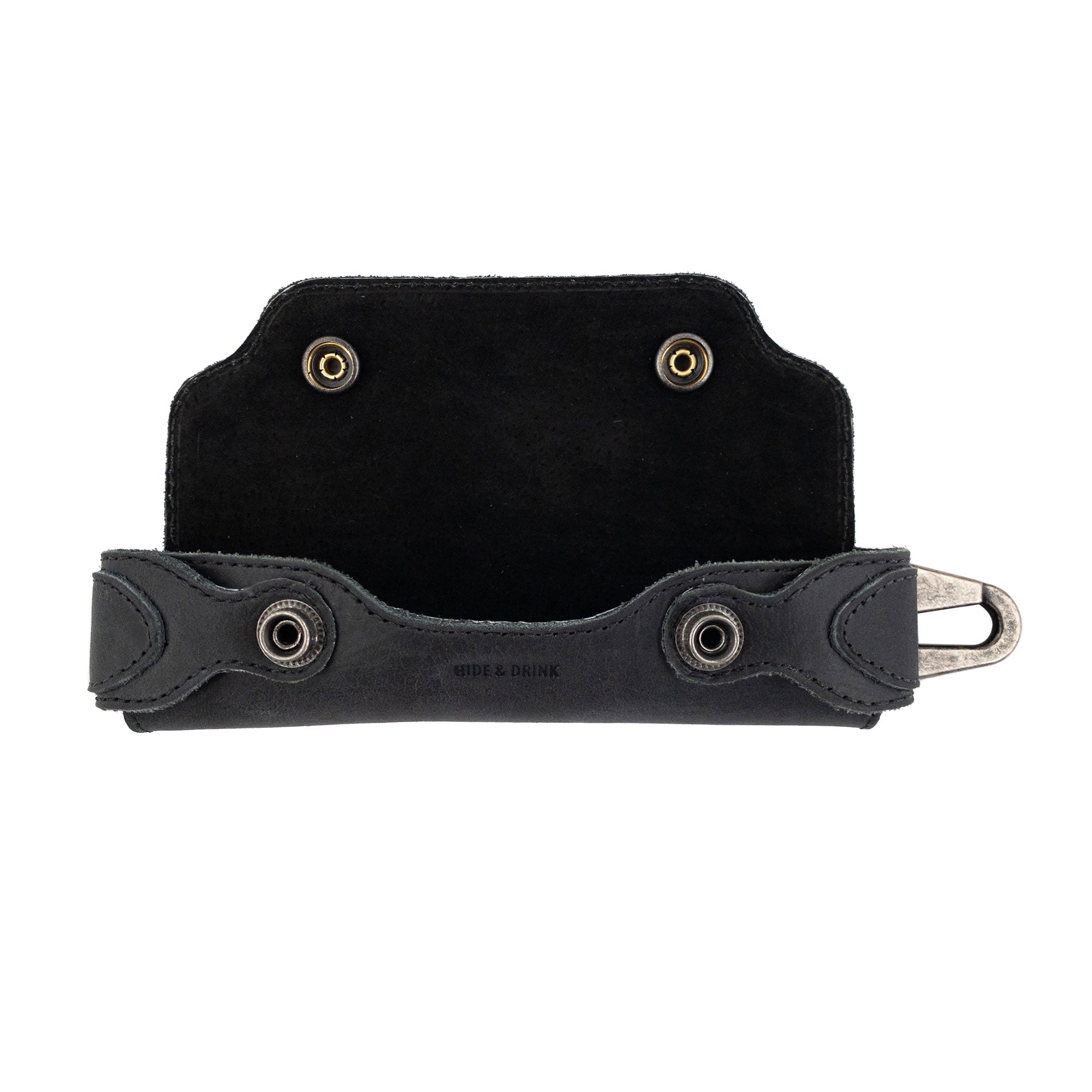 Interior details of the black Harmonica Case from Hide & Drink, designed for harmonica storage. This vintage style instrument cover is expertly crafted from full grain leather, representing the artisan craftsmanship from La Antigua Guatemala.