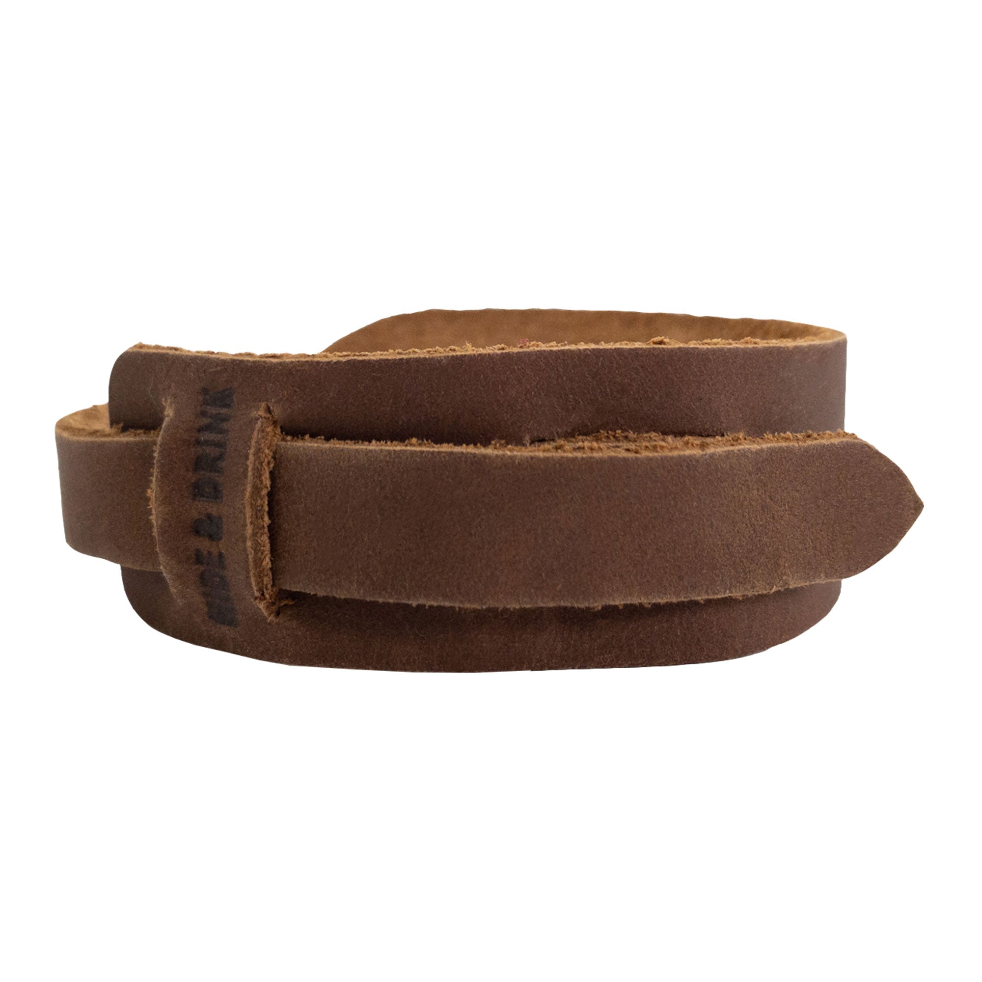 Back view of the light brown Hide & Drink Minimalist Wristband highlighting its premium full grain leather material. This stylish cuff has a secure adjustable strap, handmade by artisans in La Antigua Guatemala as part of StockyardX's rustic bracelet collection.