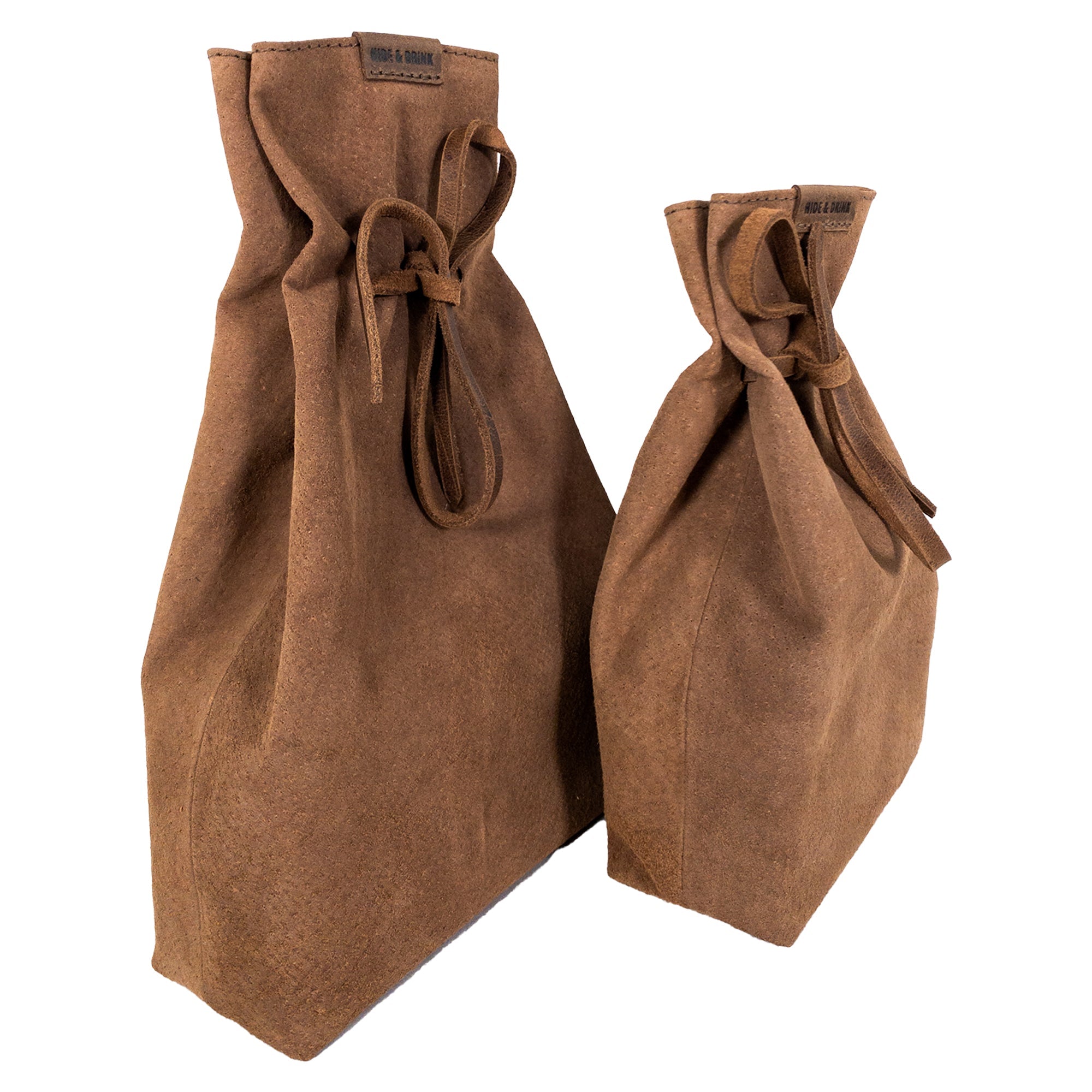 Hide & Drink's Drawstring Sack (2 pack) displayed upright, showcasing its practical size for daily use or as a gift option. Drawstring Sack (2 pack) Handmade from Sheepskin and Full Grain Leather, StockyardX, Small Batch Production, Hand Cut, Hand Sewn, Fire Branded, Artisan, Handmade in La Antigua Guatemala & Oaxaca Mexico.