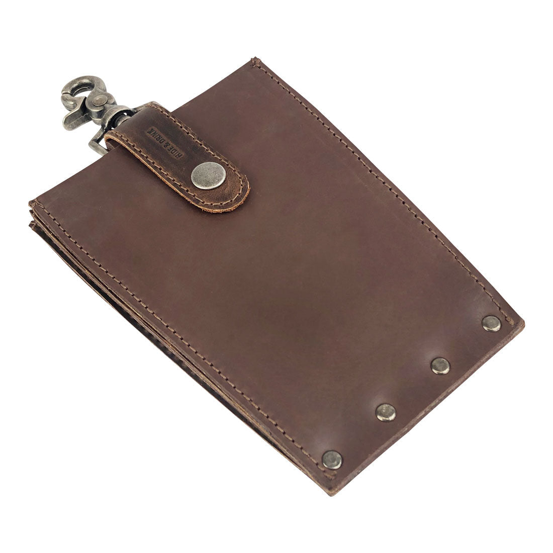 Close-up of the 'Table Hanger Organizer' by Hide & Drink, elegantly folded to reveal its high-quality full grain leather, ideal for quick and easy access to your everyday items. Table Hanger Organizer - All-Purpose Slim File with Lobster Clasp - Durable Multi Use Hanger Organizer with Clasp, Full Grain Leather, StockyardX, Small Batch Production, Hand Cut, Hand Sewn, Fire Branded, Artisan, Handmade in La Antigua Guatemala & Oaxaca Mexico.