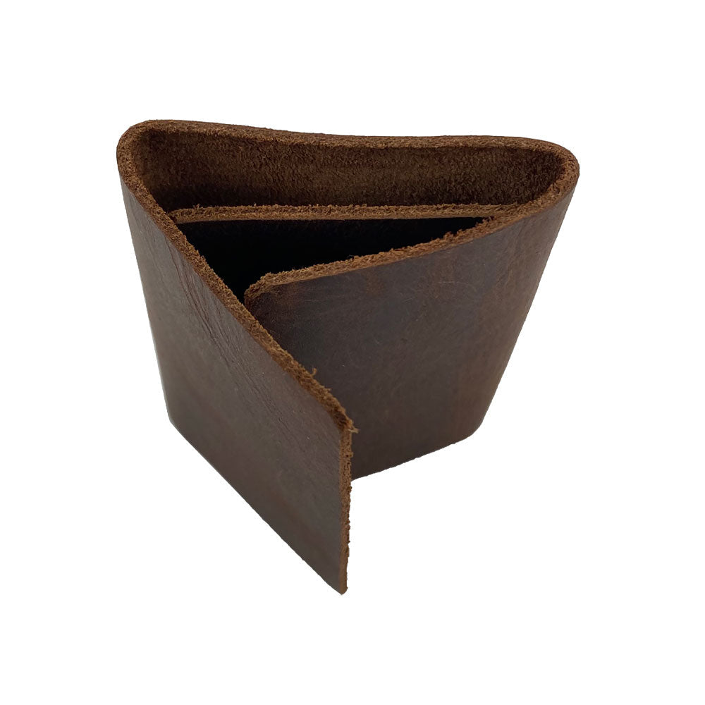 A unique angle of the Hide & Drink Minimalist Wallet Bills Only, showcasing its sleek design. This Ultra Minimalist Wallet is handcrafted from Full Grain Leather, making it an essential cash organizer for everyday use. Experience the artistry of small batch production and fire branding.