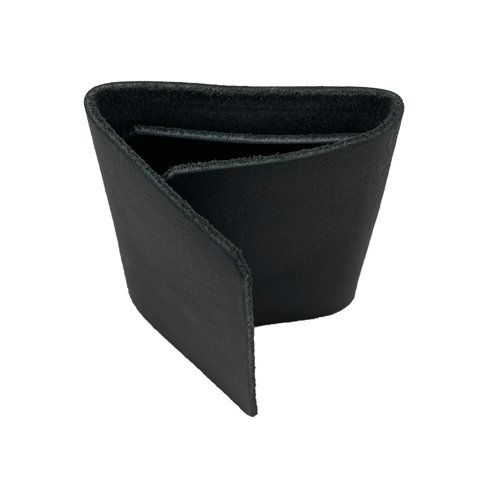 A close-up of the Hide & Drink Minimalist Wallet Bills Only aiming to showcase its textural Full Grain Leather material. This Ultra Minimalist Wallet stands out as a cash organizer that reflects the hand cut and hand sewn dedication of artisans from La Antigua Guatemala.