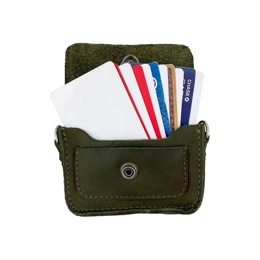 Hide & Drink's Card Holder Briefcase Style, showcasing the dimensions of the Mini Briefcase Card Holder in green Full Grain Leather. This piece is designed to hold up to 10 cards and folded bills, serving as a quality cash organizer made by artisans in La Antigua Guatemala & Oaxaca Mexico.