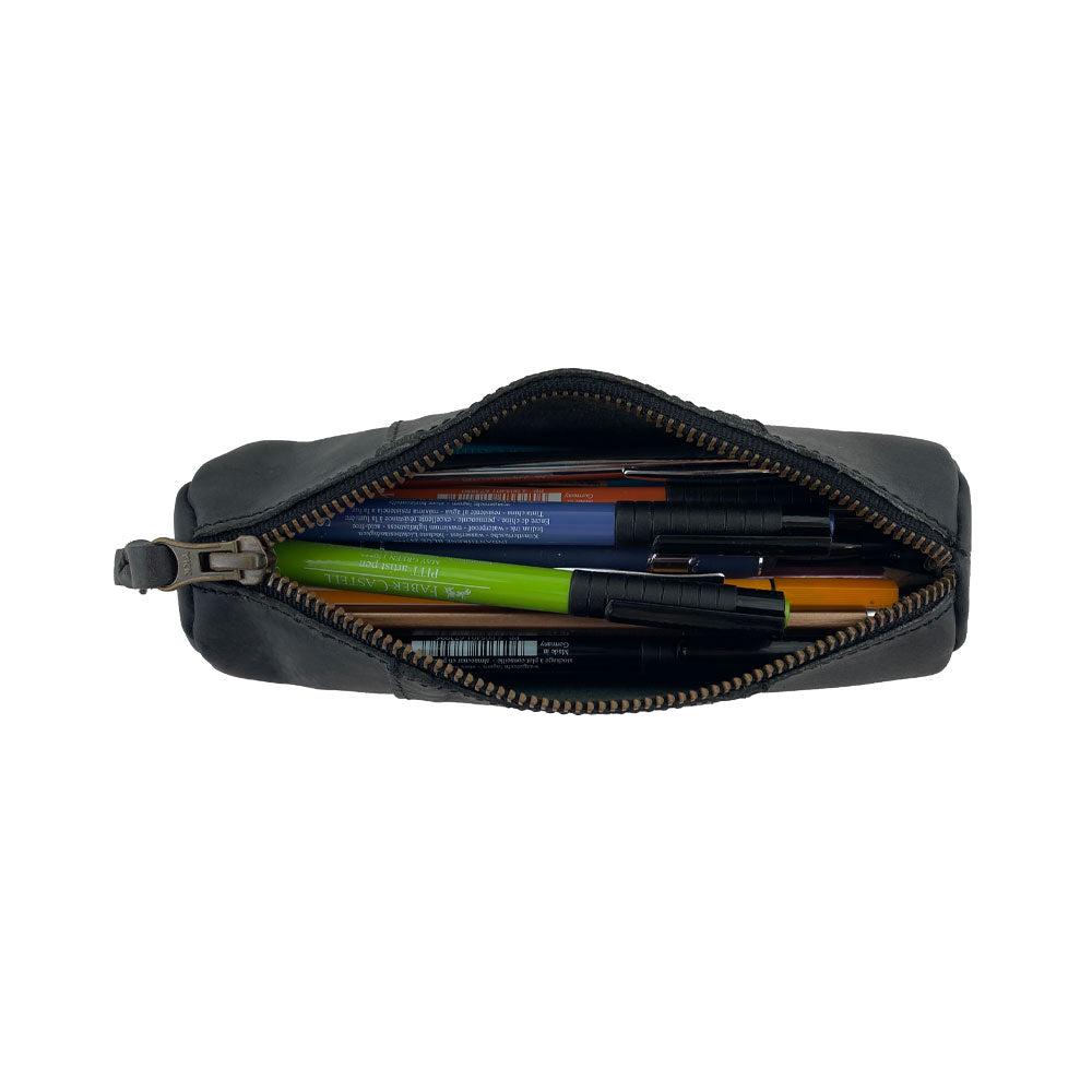 Utility Cylinder Case by Hide & Drink filled with office supplies, demonstrating its versatility and handmade quality. Crafted from Full Grain Leather, this classic bag is perfect for personal items. Cylinder Case, Rustic, Handmade.