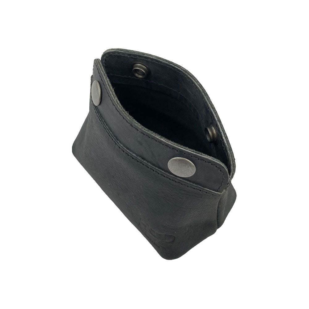 Interior shot of the Hide & Drink Double Snap Pouch, ideal for storing cash, coins, or makeup essentials. This durable full grain leather pouch embodies artisan quality from La Antigua Guatemala.
