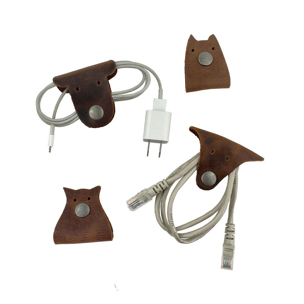 Furry Friends Cord Keeper (4-Pack), showcasing unique animal designs, created from high-quality full grain leather by Hide & Drink for neat cable storage. Furry Friends 4-Pack Cord Keeper (Cord Clam), Full Grain Leather, StockyardX, Small Batch Production, Hand Cut, Hand Sewn, Fire Branded, Artisan, Handmade in La Antigua Guatemala & Oaxaca Mexico.