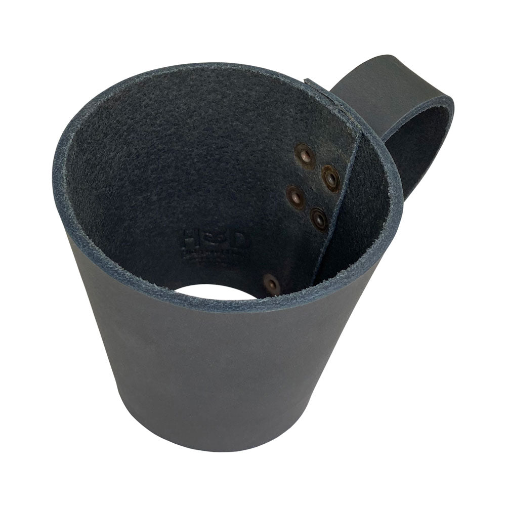 Side view of the Pint Sleeve with Handle by Hide & Drink, showcasing its unique Full Grain Leather construction. Every artisanal piece is Hand Cut and Fire Branded, ensuring style and functionality for your pub or bar experience.