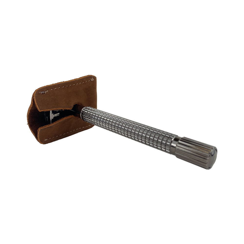 Showcasing the Razor Head Cover by Hide & Drink, this protective sheath fits over a double edge safety razor, made of full grain leather. Ideal as a shaving travel cover, it's artisan-crafted with small batch production techniques, featuring hand cut and hand sewn craftsmanship. Proudly handmade in La Antigua Guatemala & Oaxaca Mexico.