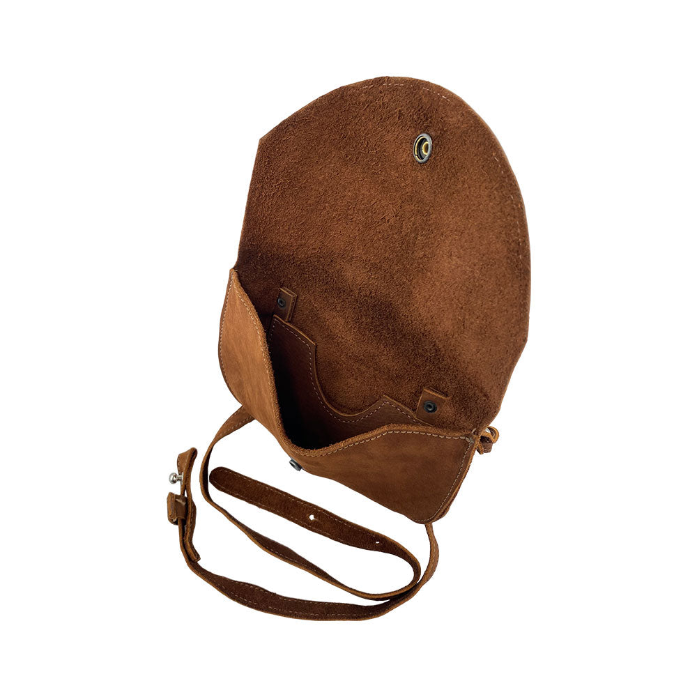 Inside view of the light tan Hide & Drink Hip and Shoulder Bag, demonstrating its Full Grain Leather structure and artisan design. Crafted through Small Batch Production, it features hand cut and hand sewn details. Handmade in La Antigua Guatemala & Oaxaca Mexico.