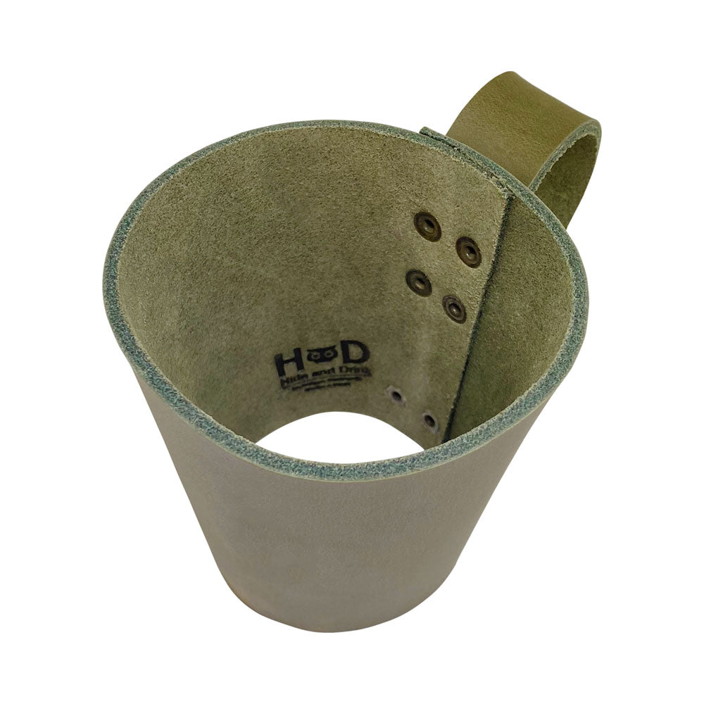 Unique Pint Sleeve with Handle by Hide & Drink showcasing its rich Full Grain Leather craftsmanship. This artisan piece is handcrafted through Small Batch Production, adding a rustic touch to your drink.