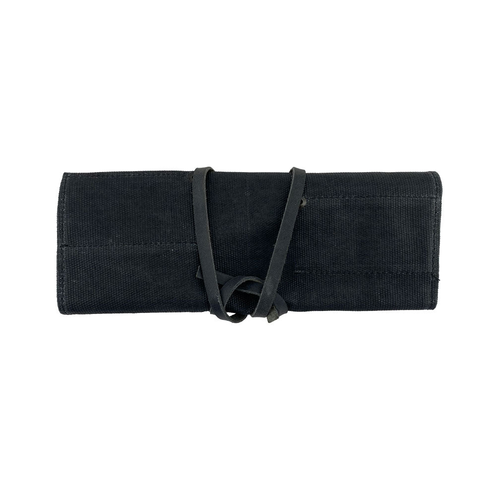 Hide & Drink Tool Roll showcases an elegant small tool roll-up bag with 10 slots, made from quality full grain leather. Ideal for a portable carry-on pouch, it organizes woodworking tools and enhances any workshop storage setup. Each item is handmade by artisans in La Antigua Guatemala & Oaxaca Mexico.