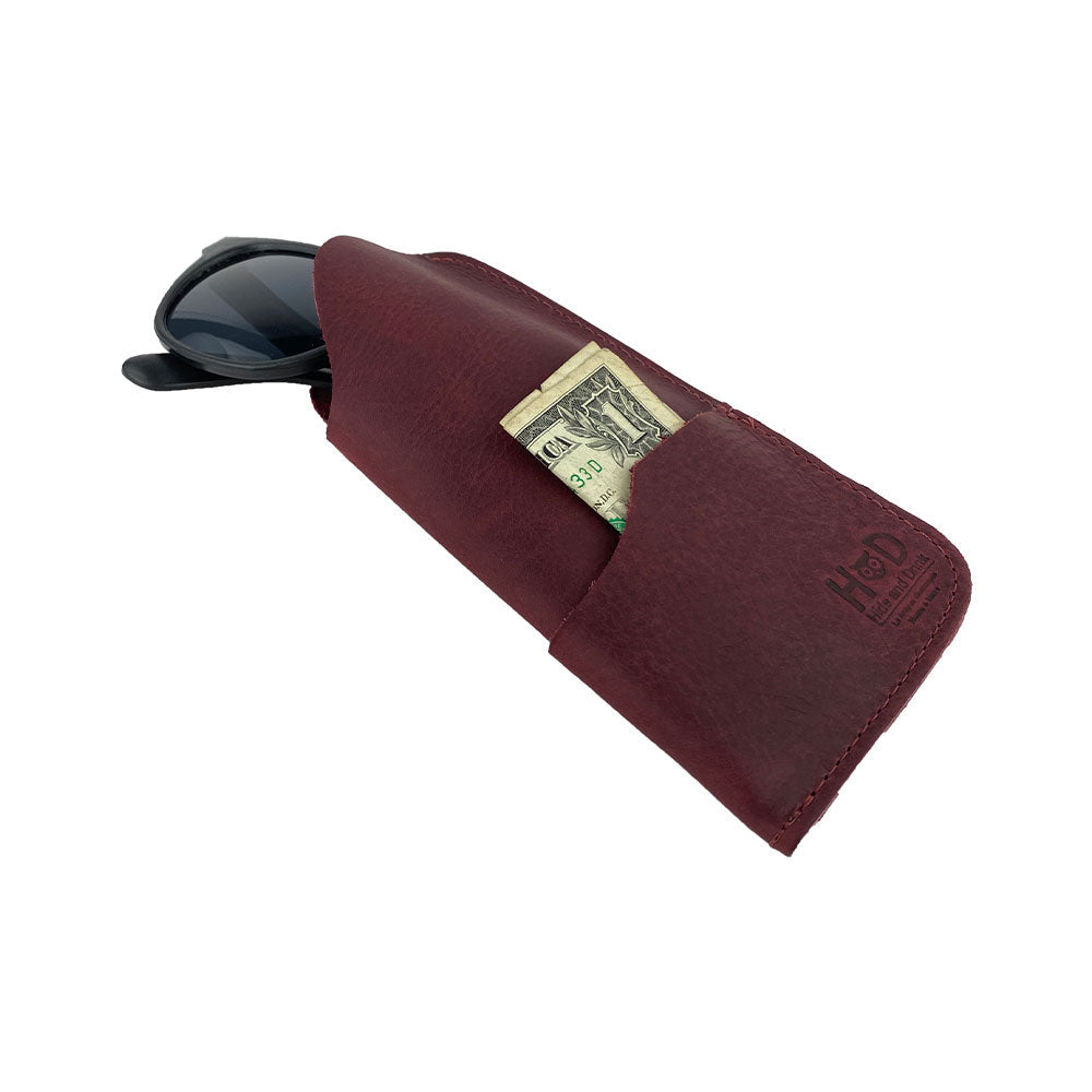 The Hide & Drink Sunglass Case & Wallet presented in a tan finish, confirming its rustic charm. This Rustic Sunglasses Case & Wallet provides excellent protection as a Full Grain Leather glasses protector for travel, inspired by artistry from La Antigua Guatemala & Oaxaca Mexico.