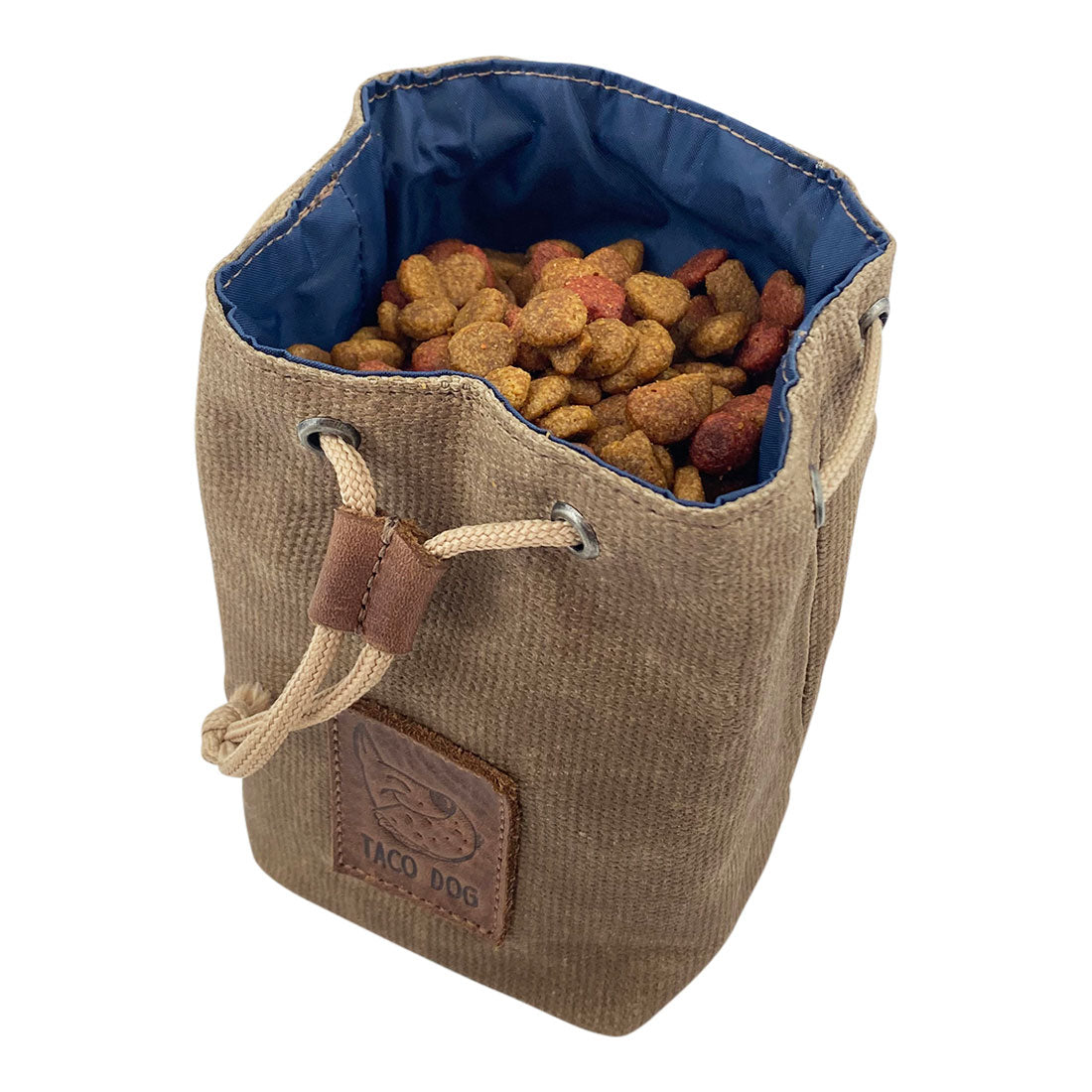 Open Taco Dog Treat Training Bag filled with dog treats, designed for easy access while training. This pouch is made from durable waxed canvas and showcases artisan craftsmanship from La Antigua Guatemala, perfect for dog trainers.