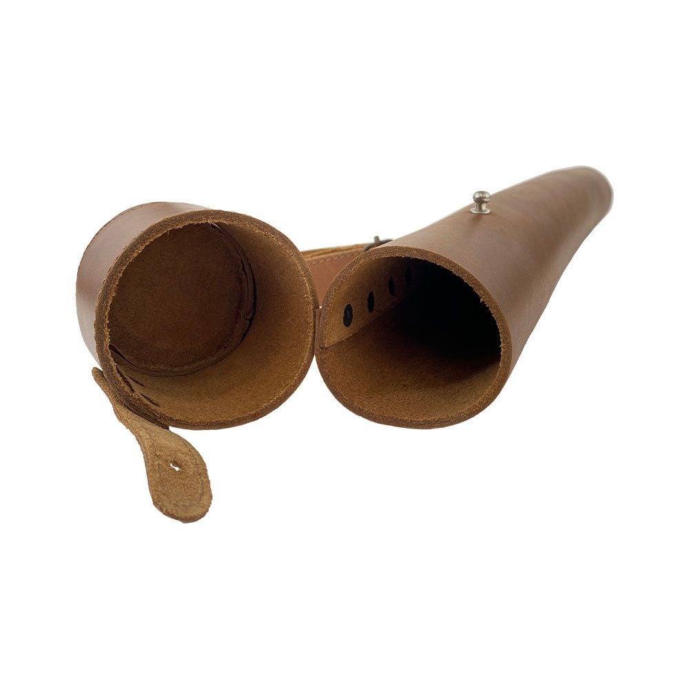 Hide & Drink's Blueprint Tube (A2 Paper Size) displayed next to architectural plans, highlighting its practical use. This artisan-made document storage tube features an adjustable strap and is crafted from full grain leather, reflecting StockyardX's small batch production and handmade quality from La Antigua Guatemala & Oaxaca Mexico.