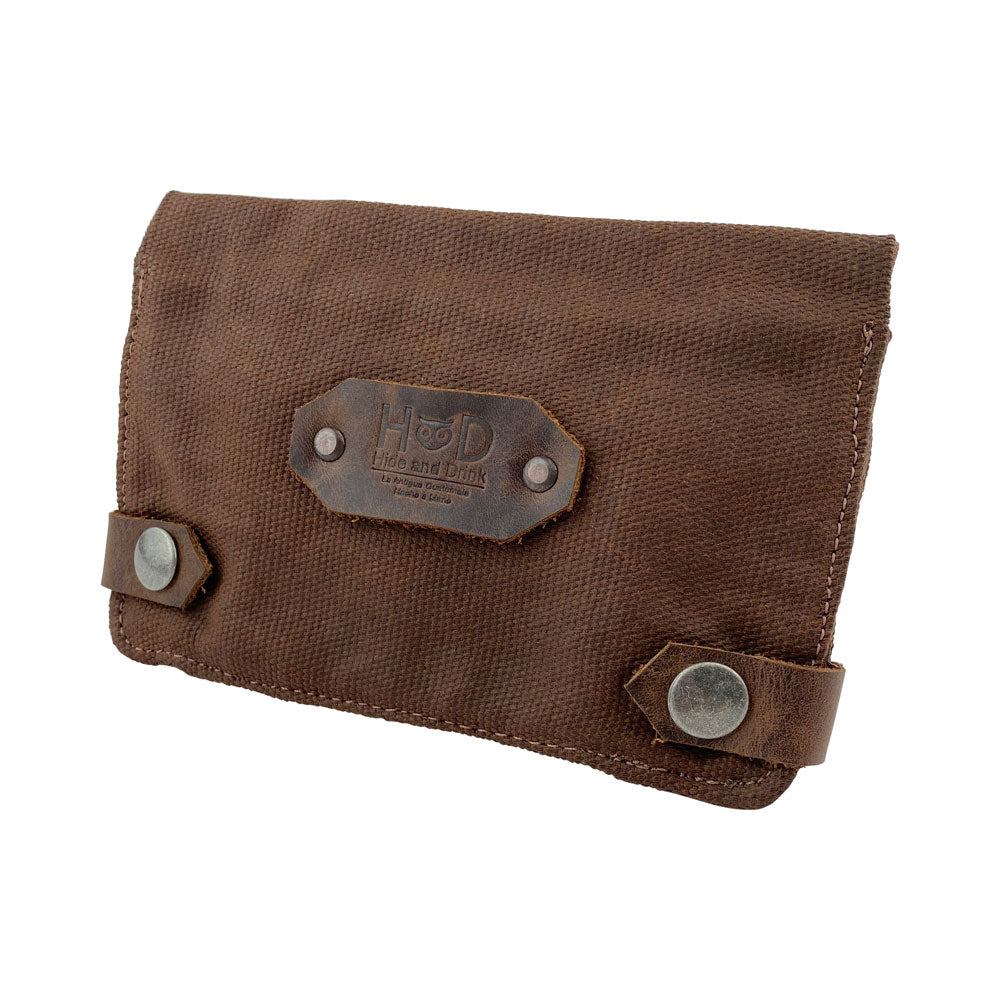 Side view of the dark brown Hide & Drink Tobacco Pouch Waxed Canvas, showcasing the quality materials used in its construction. A great addition for tobacco enthusiasts, it blends functional design with artisan craftsmanship.