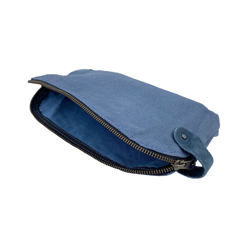 Dopp Kit Utility Bag by Hide & Drink showcasing a stylish silhouette ideal for organizing essentials. This large rustic all-purpose Dopp Kit Utility Bag is made from full grain leather and emphasizes artisan craftsmanship in its hand cut and hand sewn construction, handmade in La Antigua Guatemala & Oaxaca Mexico.