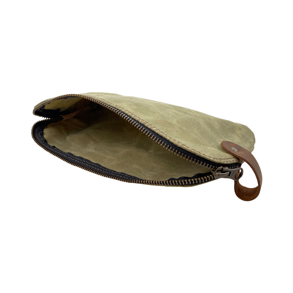 Dopp Kit Utility Bag by Hide & Drink displaying its handcrafted artistry and practical use case. This artisan Dopp Kit Utility Bag is made from full grain leather, showcasing the significance of small batch production with hand cut and hand sewn craftsmanship, handmade in La Antigua Guatemala & Oaxaca Mexico.