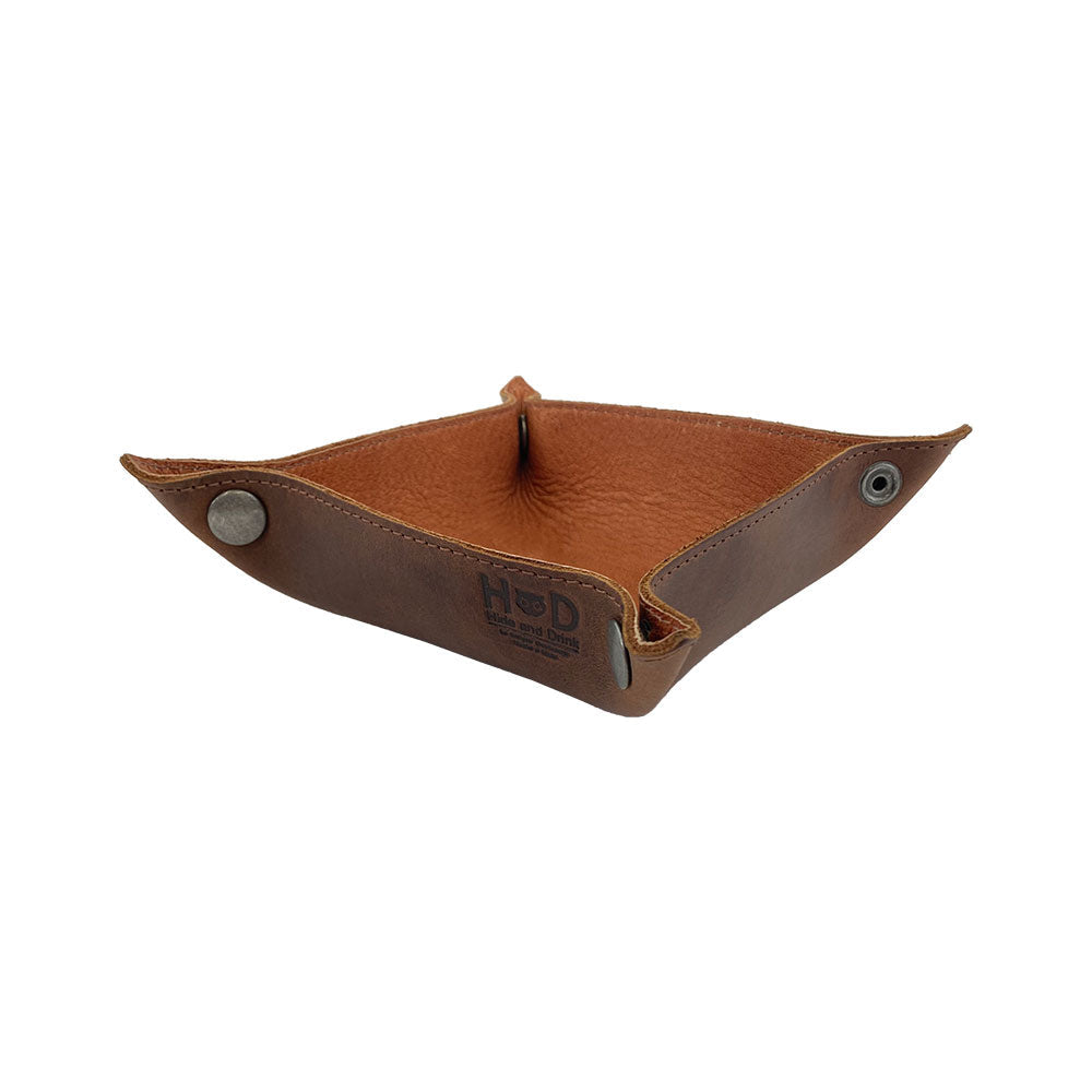 Stylish Valet Tray with Sheep Skin by Hide & Drink, formed into a practical storage solution for items like keys and change. This tray stands out with its rustic design and high-quality leather, providing an attractive way to keep personal belongings organized. Each handmade piece showcases the craftsmanship of small batch production, perfect for both home and travel needs.