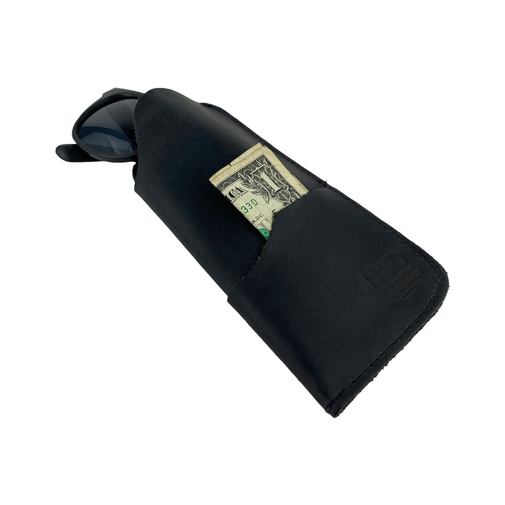 The Hide & Drink Sunglass Case & Wallet in a protective stance, designed for convenience. This Rustic Sunglasses Case & Wallet features Full Grain Leather artistry, serving as an essential glasses protector for travel, embroidered with artisan ethos from La Antigua Guatemala & Oaxaca Mexico.