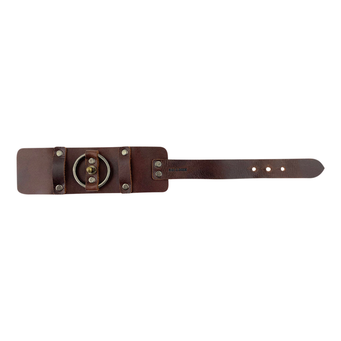 Expanded view of the Hide & Drink Wristband displaying its adjustable feature and leather quality. This distinct Wristband with Ring Decoration Full Grain Leather from StockyardX showcases small batch production with artisan flair. Hand cut, hand sewn, and fire branded, it embodies the craftsmanship of artisans in La Antigua Guatemala & Oaxaca Mexico.