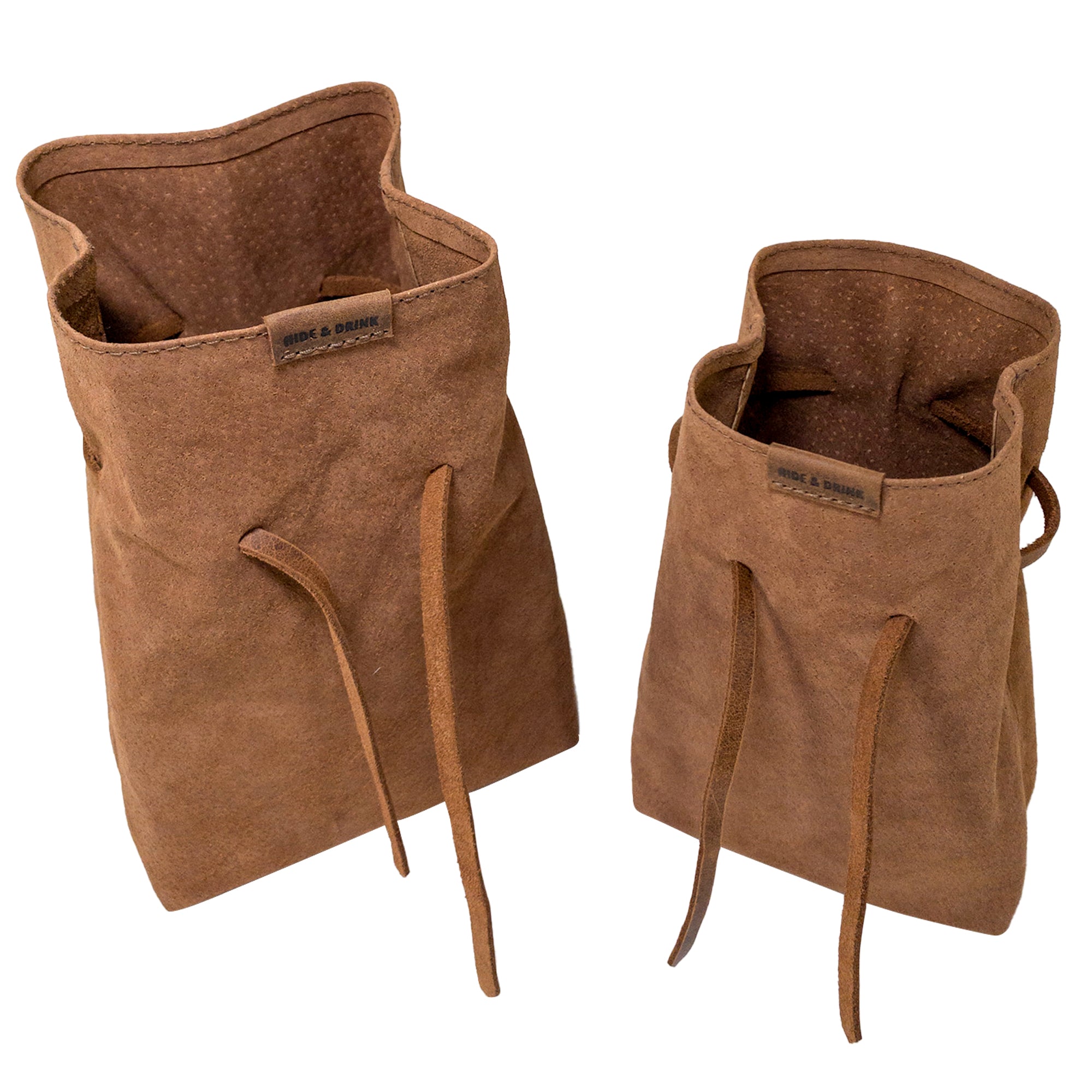 Showcasing Hide & Drink's Drawstring Sack (2 pack) in action, filled with gadgets, proving its functionality and style. Drawstring Sack (2 pack) Handmade from Sheepskin and Full Grain Leather, StockyardX, Small Batch Production, Hand Cut, Hand Sewn, Fire Branded, Artisan, Handmade in La Antigua Guatemala & Oaxaca Mexico.
