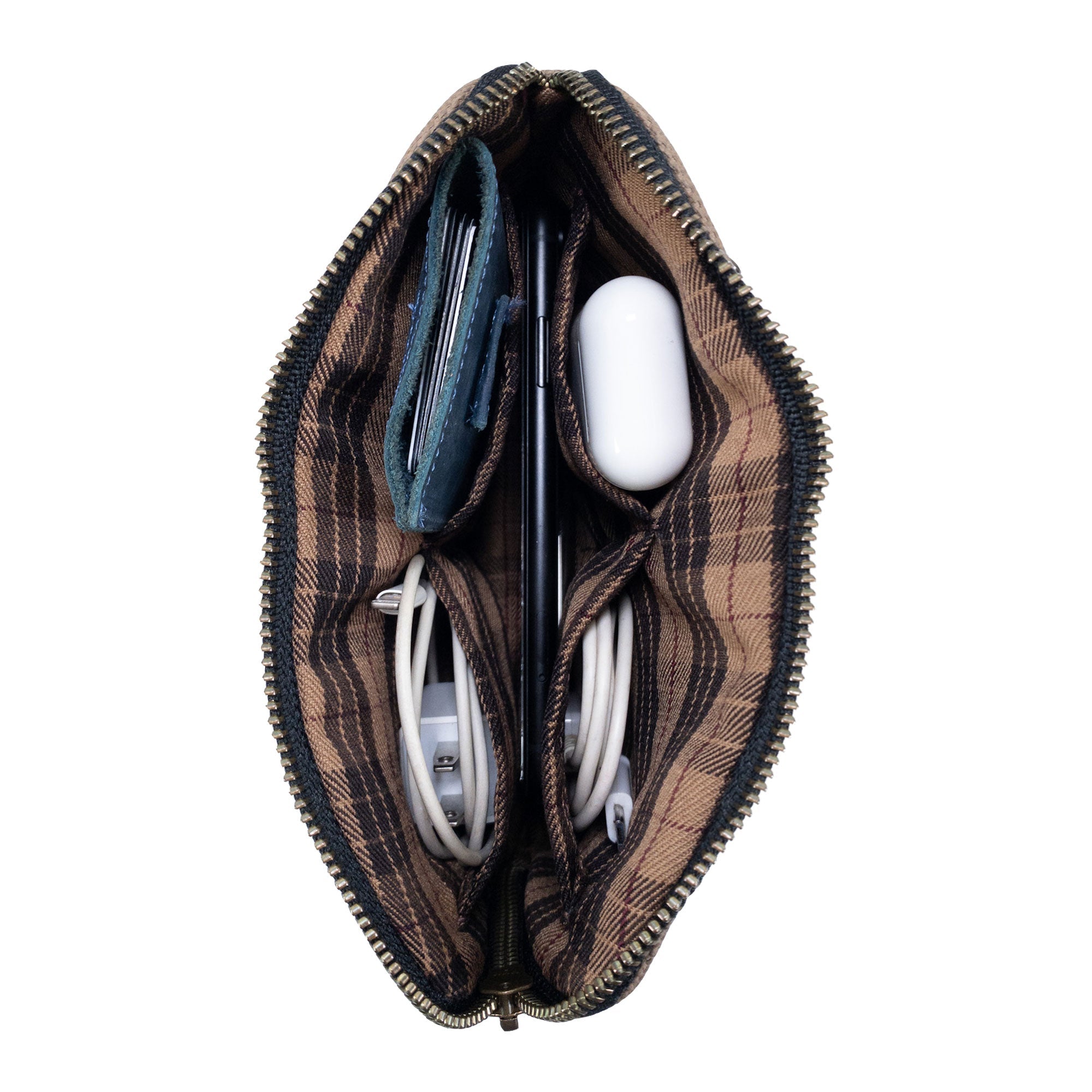 Interior shot of Hide & Drink's brown Zipper Gear Pouch displaying its organized compartments, perfect for storing chargers and essentials, made of water resistant waxed canvas.