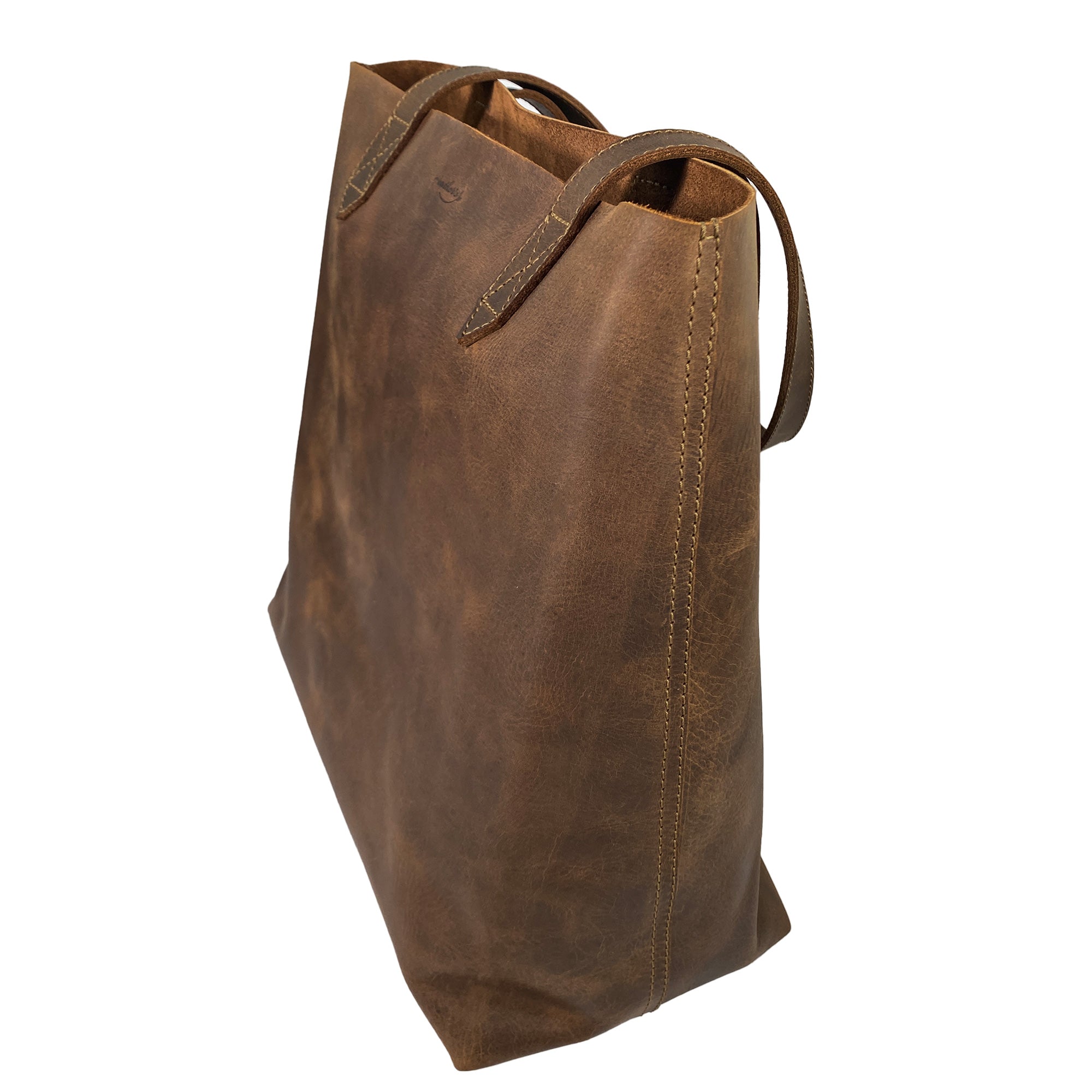 Back view of Heather's Classic Tote Bag made from exquisite full grain leather, showcasing its robust construction. This vintage style purse is perfect for stylish travel and shopping adventures, created with care in La Antigua Guatemala.