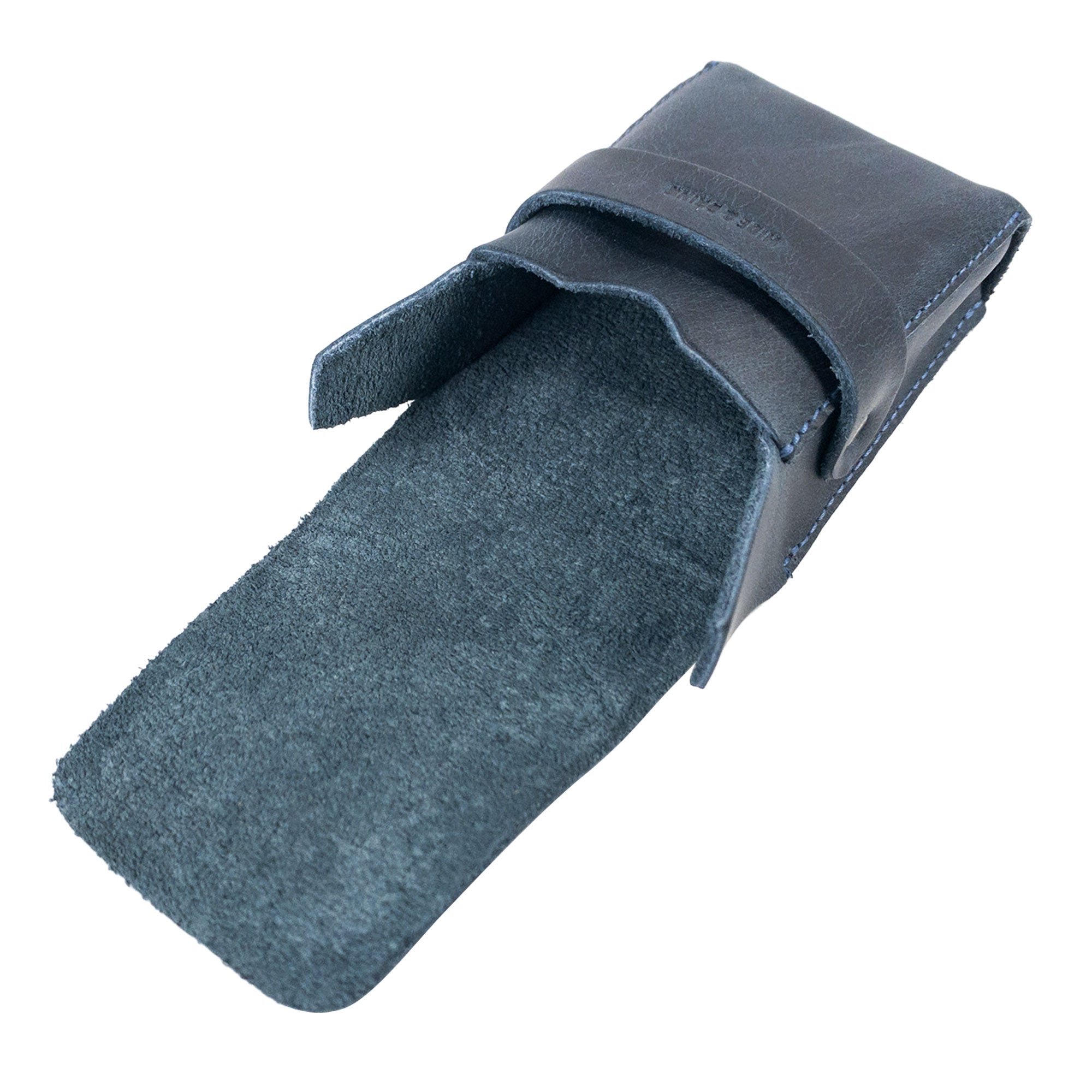 Open view of Hide & Drink's navy Playing Card Case with soft suede lining. Perfect for secure storage of classic playing cards (not included), this travel accessory features premium full grain leather. Handcrafted by artisans, it's a quality item from StockyardX.