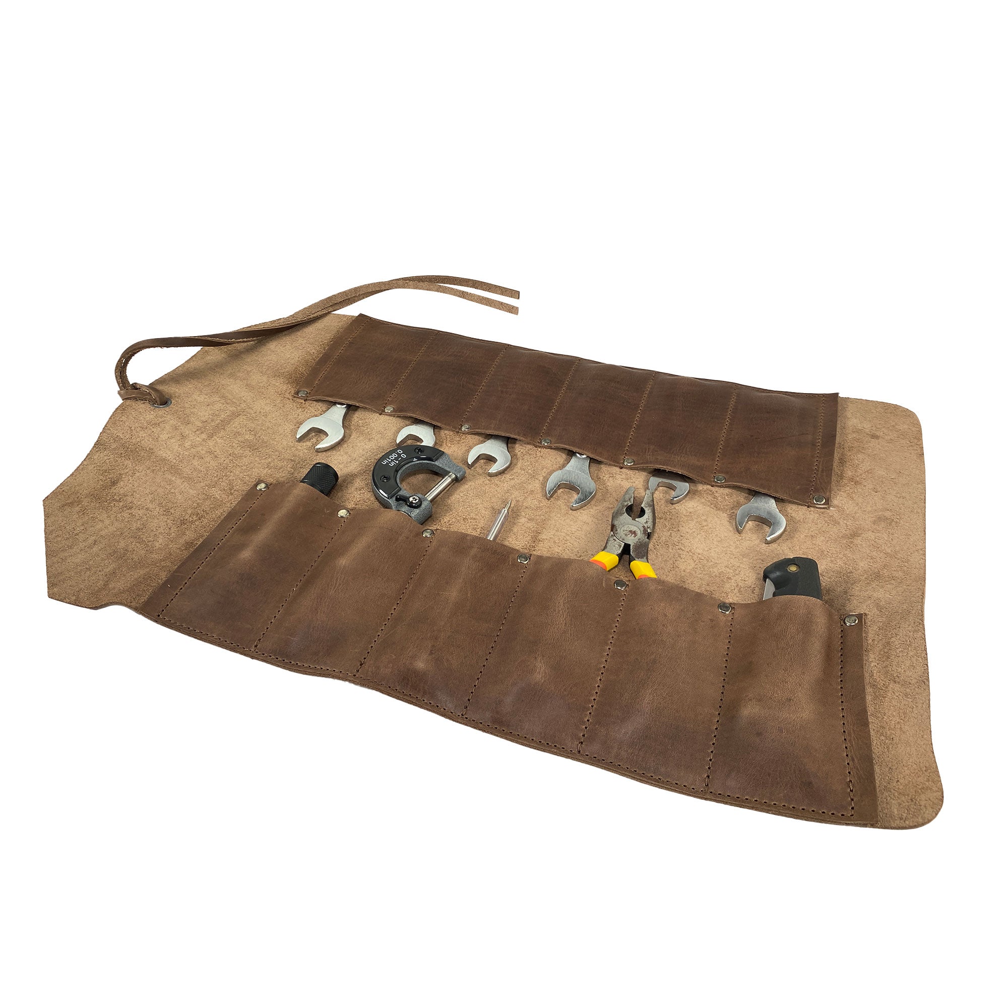 An open view of the 12 Pocket Tool Roll - Home Storage from Heavy Duty Hide, illustrating its capacity for storing various tools. This vintage-style tool organizer is a versatile portable carry-on pouch, made with care in La Antigua Guatemala, from Full Grain Leather.
