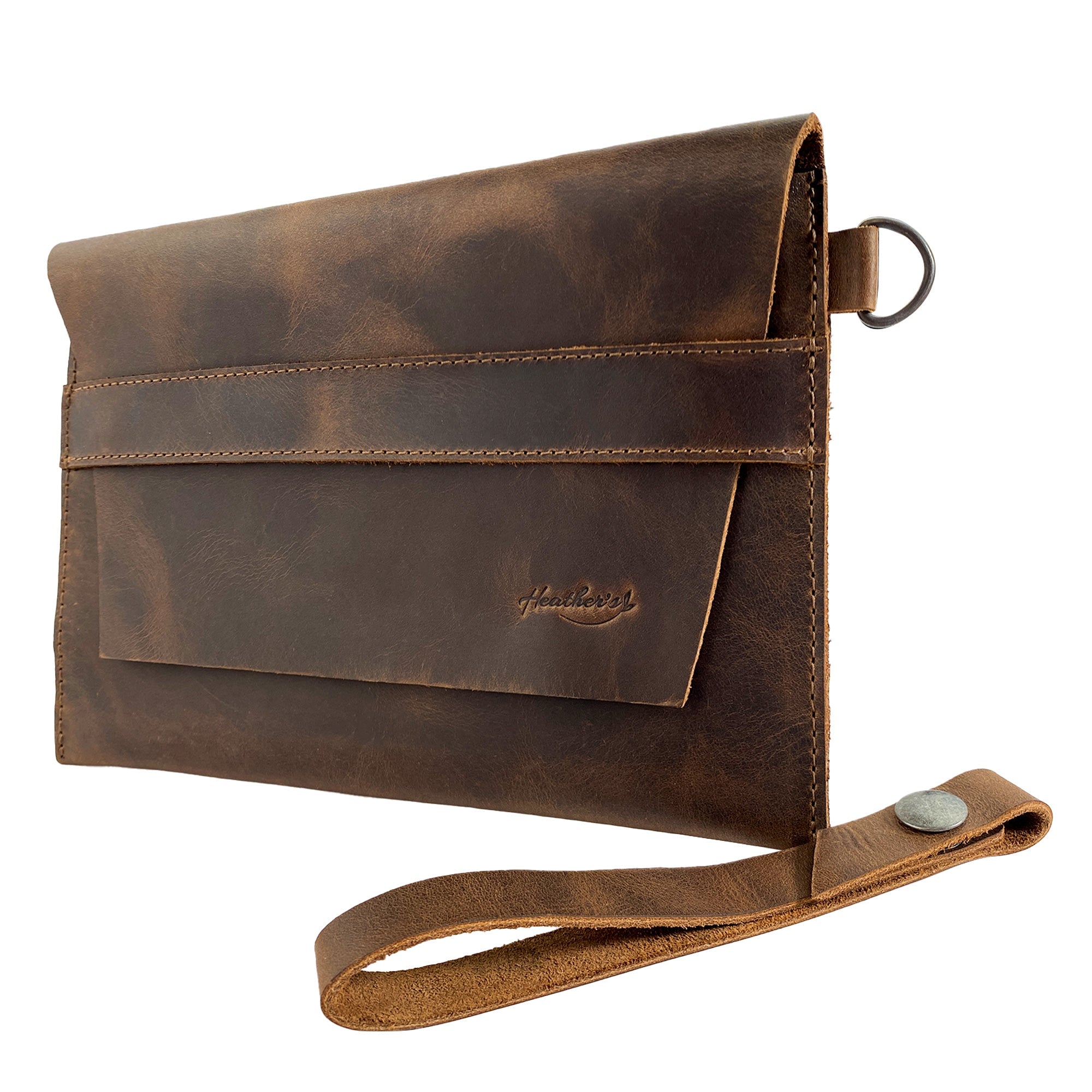 Heather's Vintage Clutch Bag presented at an angle, designed as a versatile wrist wallet for cards, money, and coins. This handmade clutch utilizes premium full grain leather, demonstrating the artisanal approach of small batch production in La Antigua Guatemala & Oaxaca Mexico.